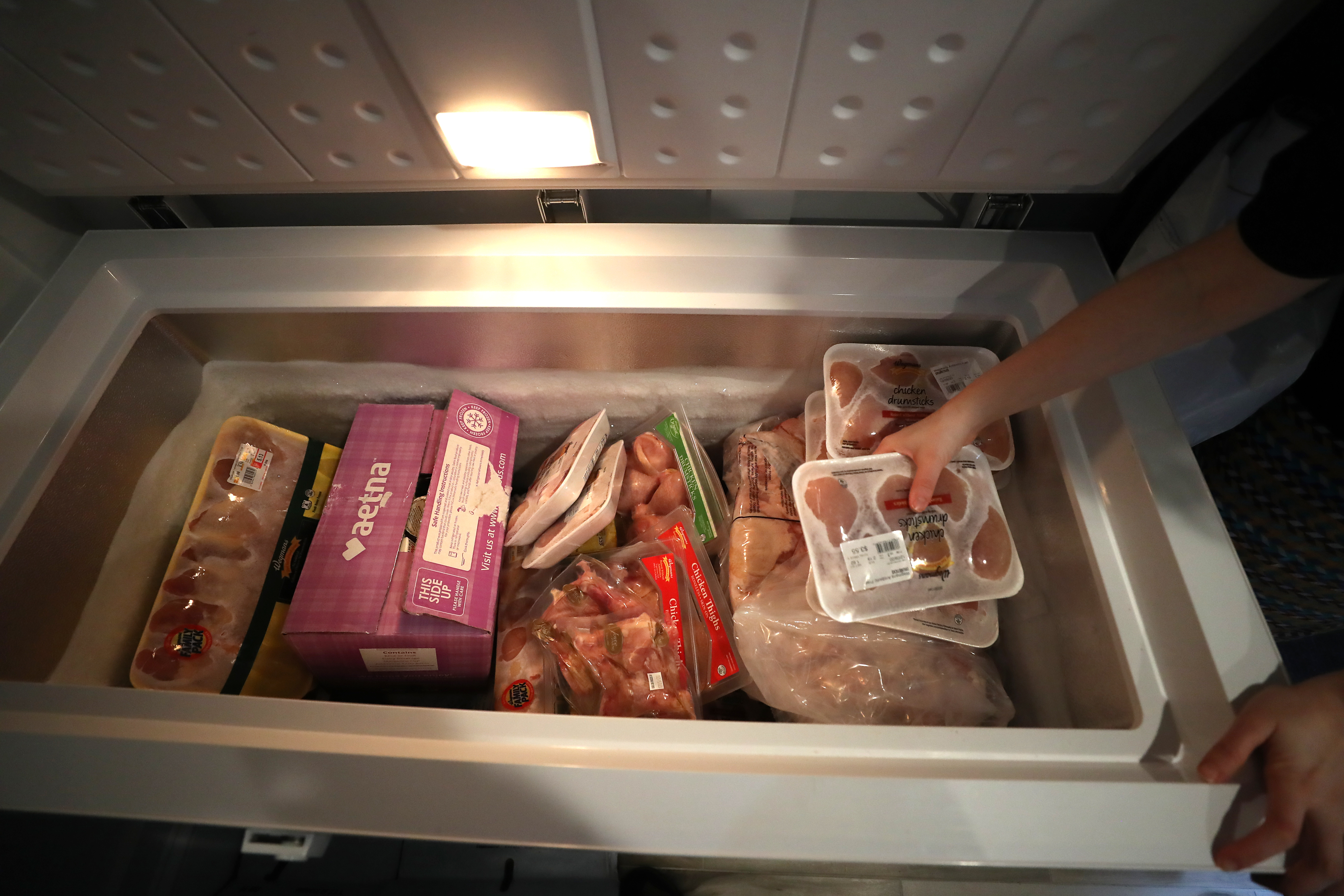 A freezer full of food at the Weinstein-Jones home. The couple runs FabiYana’s Urgent Foods, delivering food and supplies to people in need.