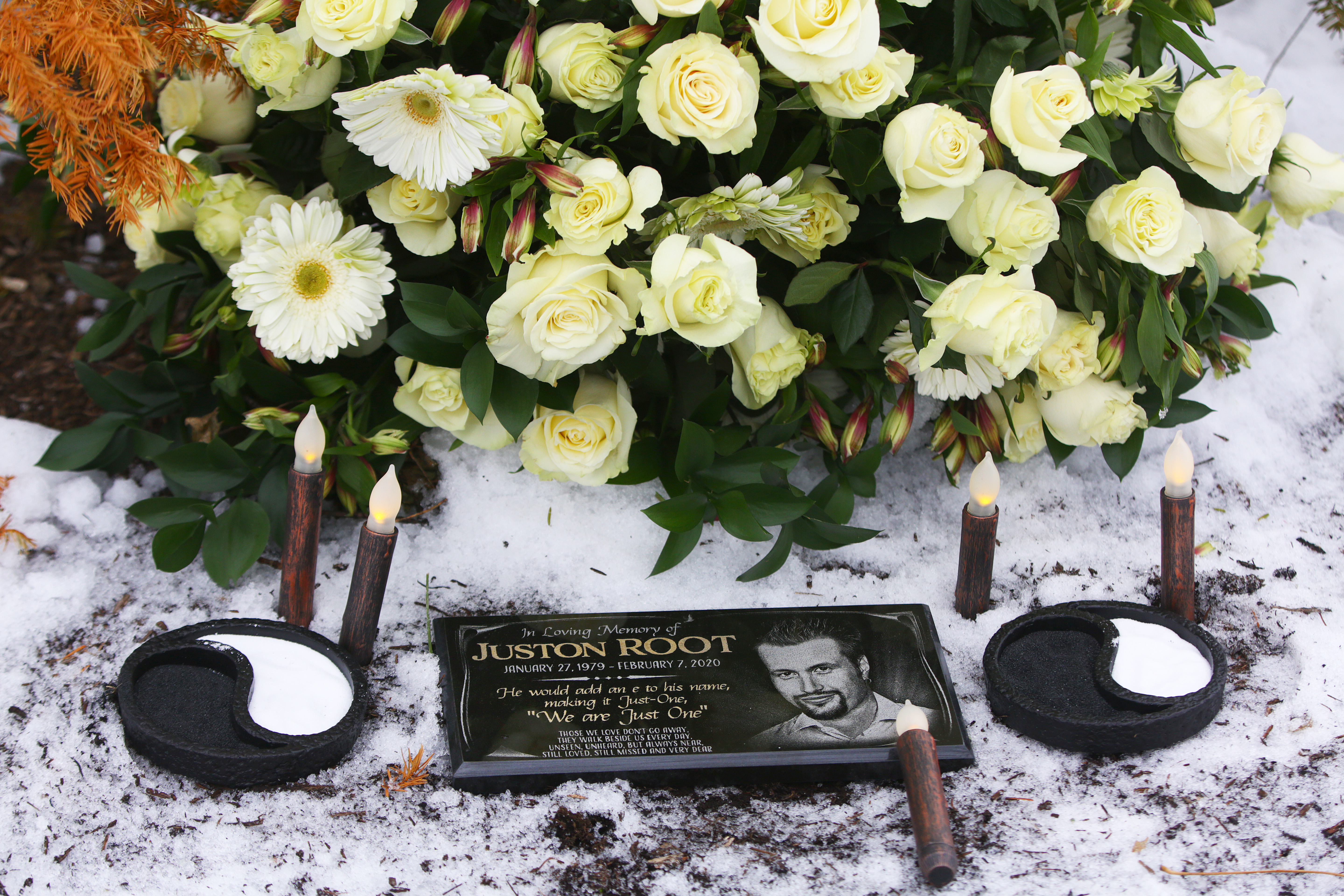 The family of Juston Root held a vigil on Sunday, Feb. 7, 2021, the one-year anniversary of the 41-year-old man's killing next to a Chestnut Hill shopping parking lot. Six law enforcement officers fired off 31 rounds, striking Root numerous times.