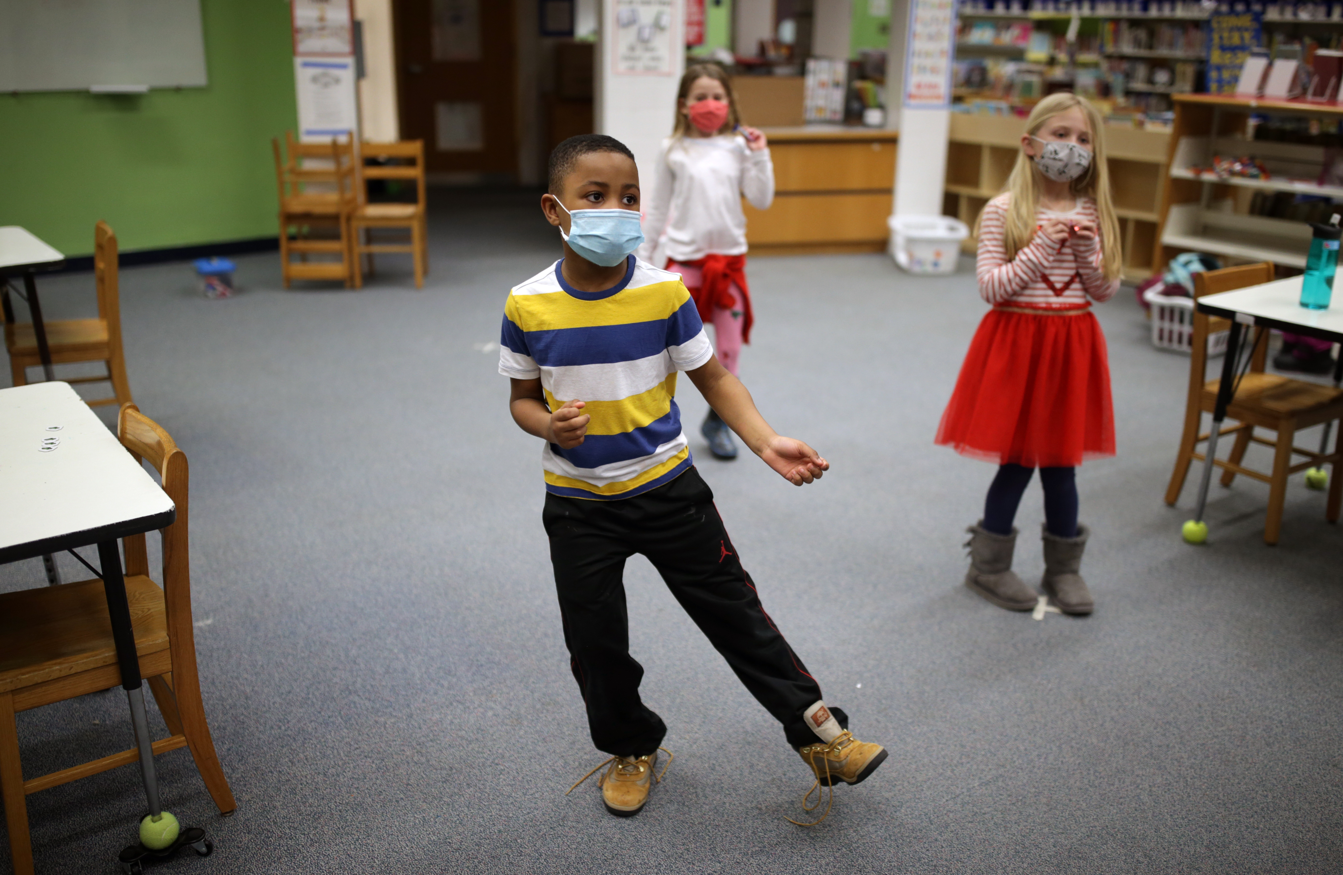 Jeremiah Frazier, 7, participates in the YMCA of the North Shore's in-person program for kids at the Ayers Ryal Side School in Beverly.