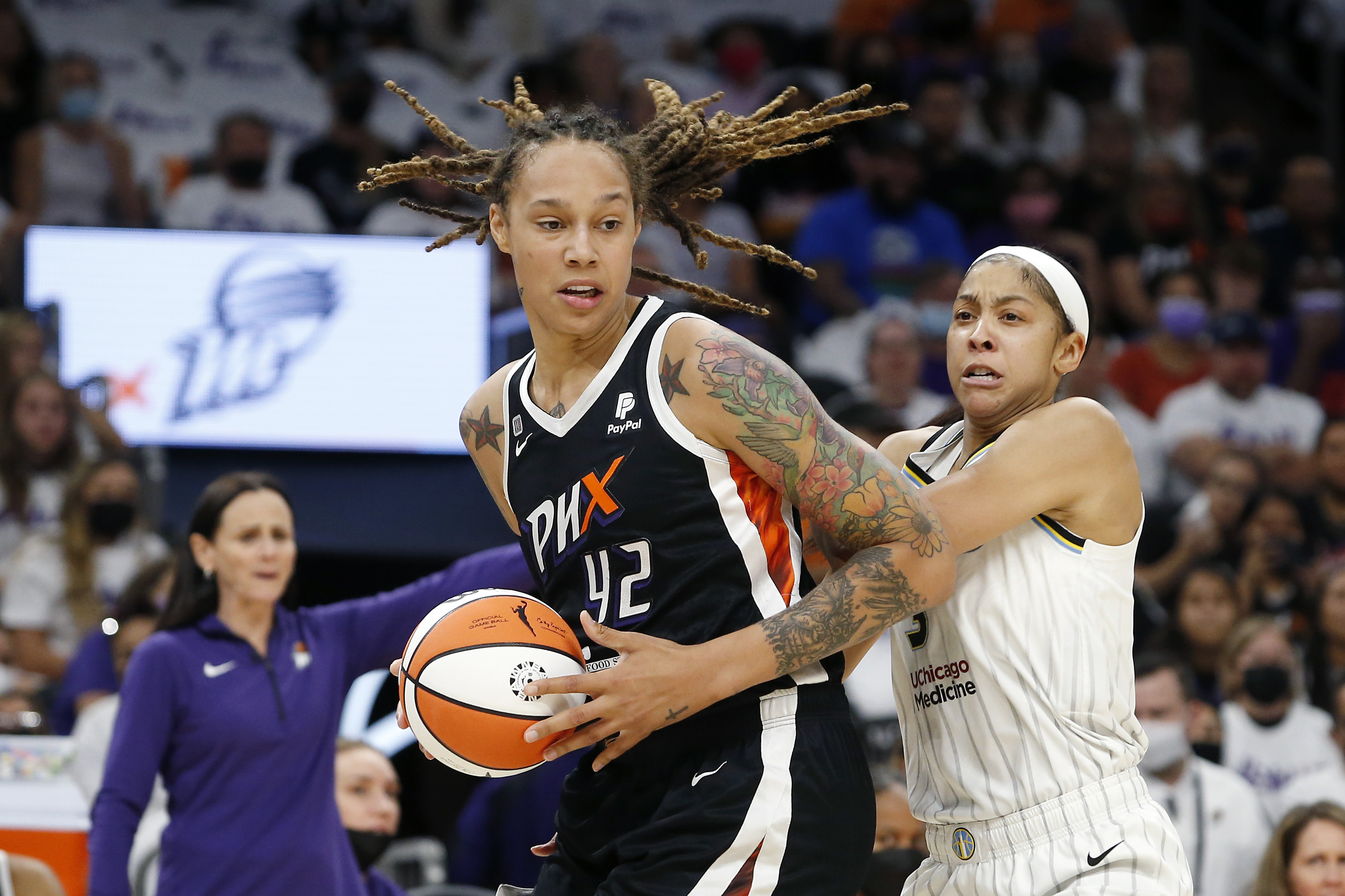 Phoenix Mercury center Brittney Griner (42) drives past Chicago Sky forward Candace Parker (3) during the first half of Game 1 of the WNBA basketball Finals on Sunday in Phoenix.