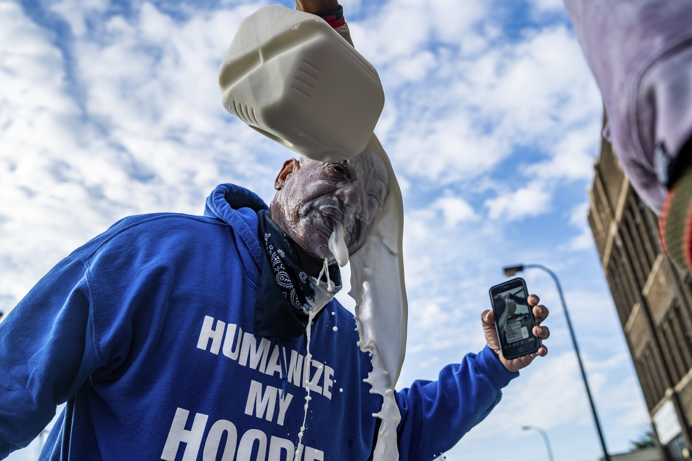 A man had milk poured over he face after he was affected by chemical irritant used by Minneapolis police during protests Wednesday.