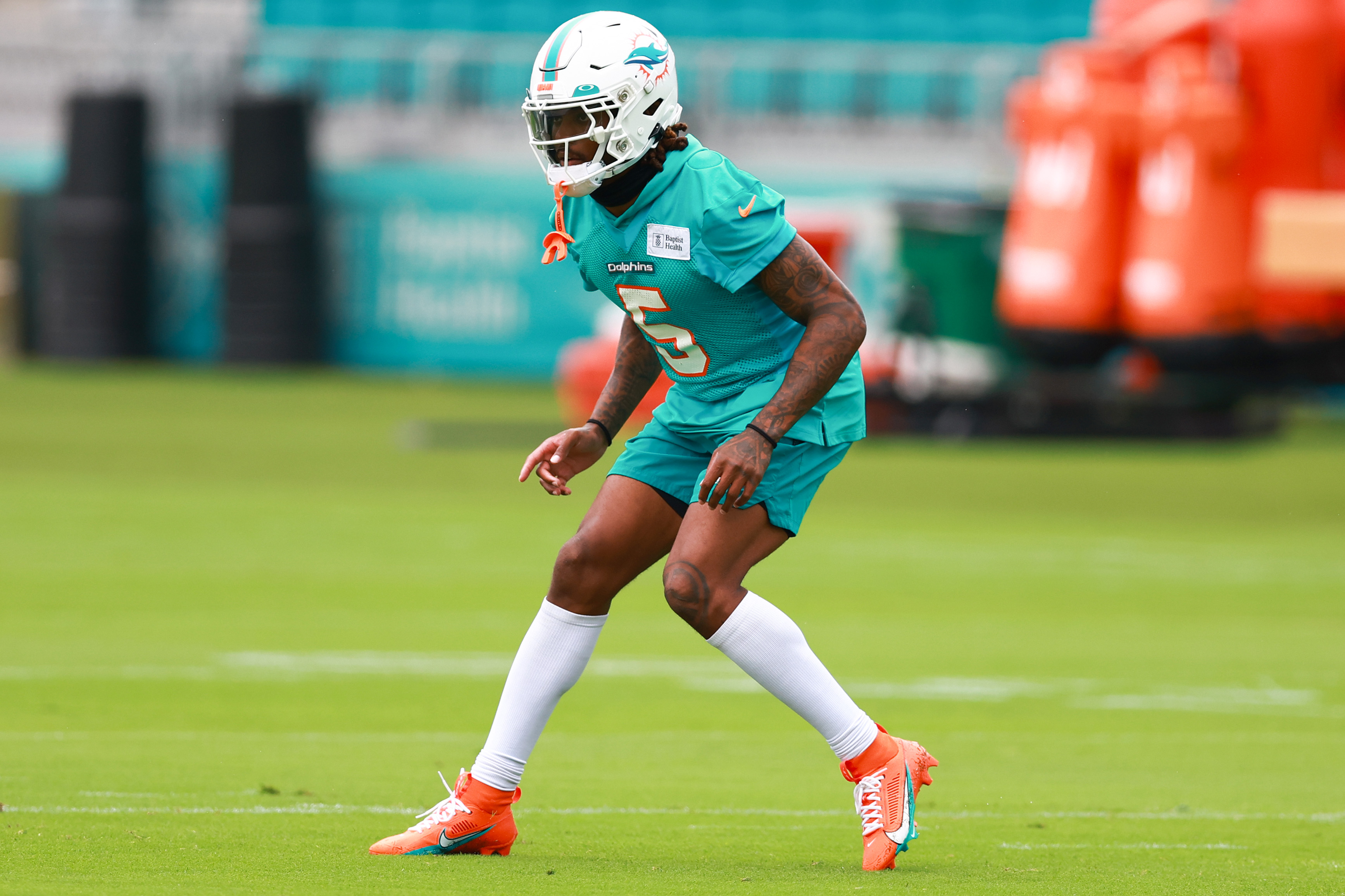 Miami Dolphins cornerback Jalen Ramsey (5) talks with a member of the  coaching staff during practice at the NFL football team's training  facility, Thursday, July 27, 2023, in Miami Gardens, Fla. (AP