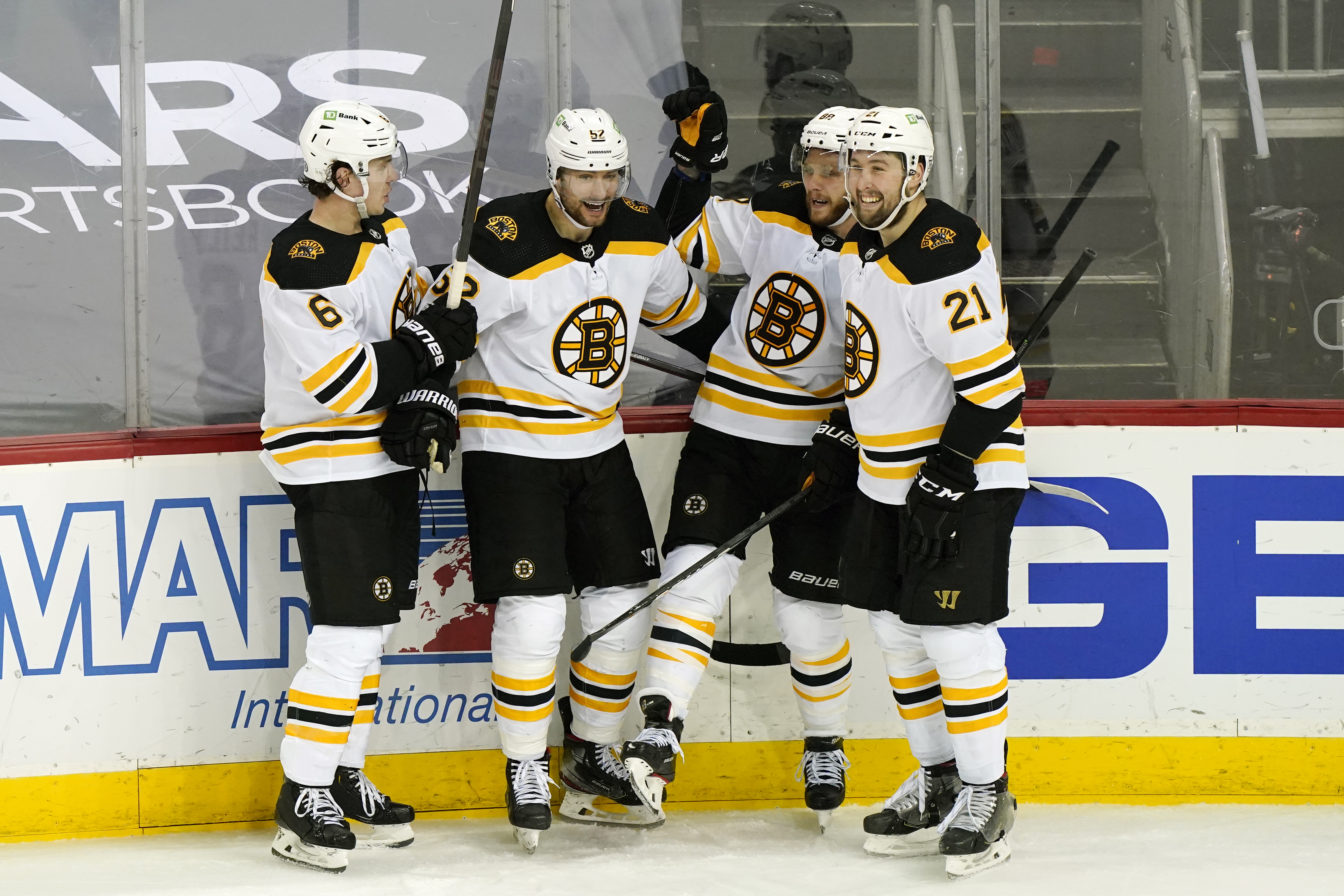 Mike Reilly, David Pastrnak and Nick Ritchie celebrate with Sean Kuraly after Kuraly scored his fourth of the season in the third period of Tuesday's game.