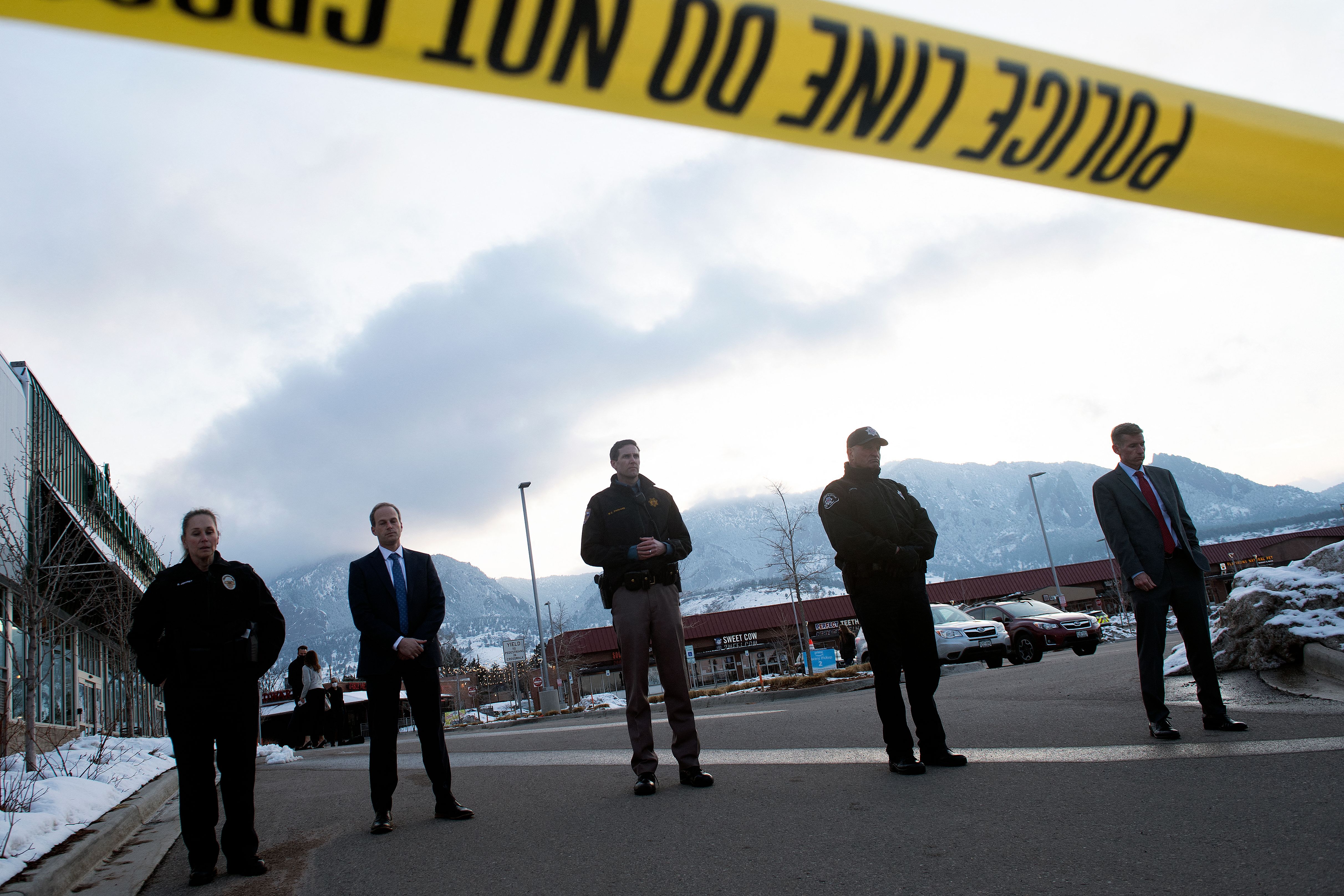 Law enforcement officials waited to address the media after a mass shooting at the King Soopers grocery store in Boulder, Colo.