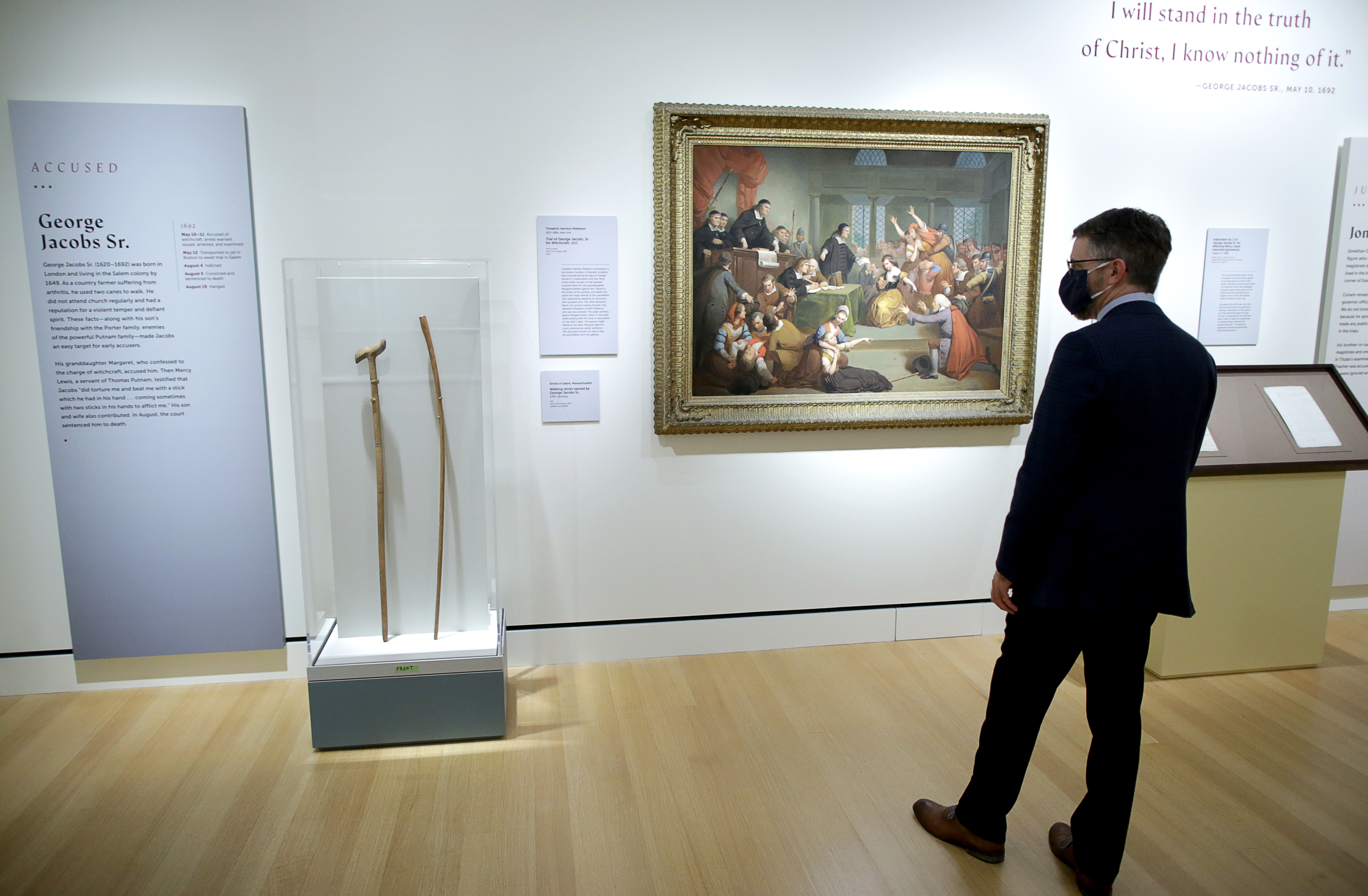 Daniel Lipcan, head librarian for the Peabody Essex Museum, views the exhibit on George Jacobs Sr., who was among those hanged during the Witch Trials.