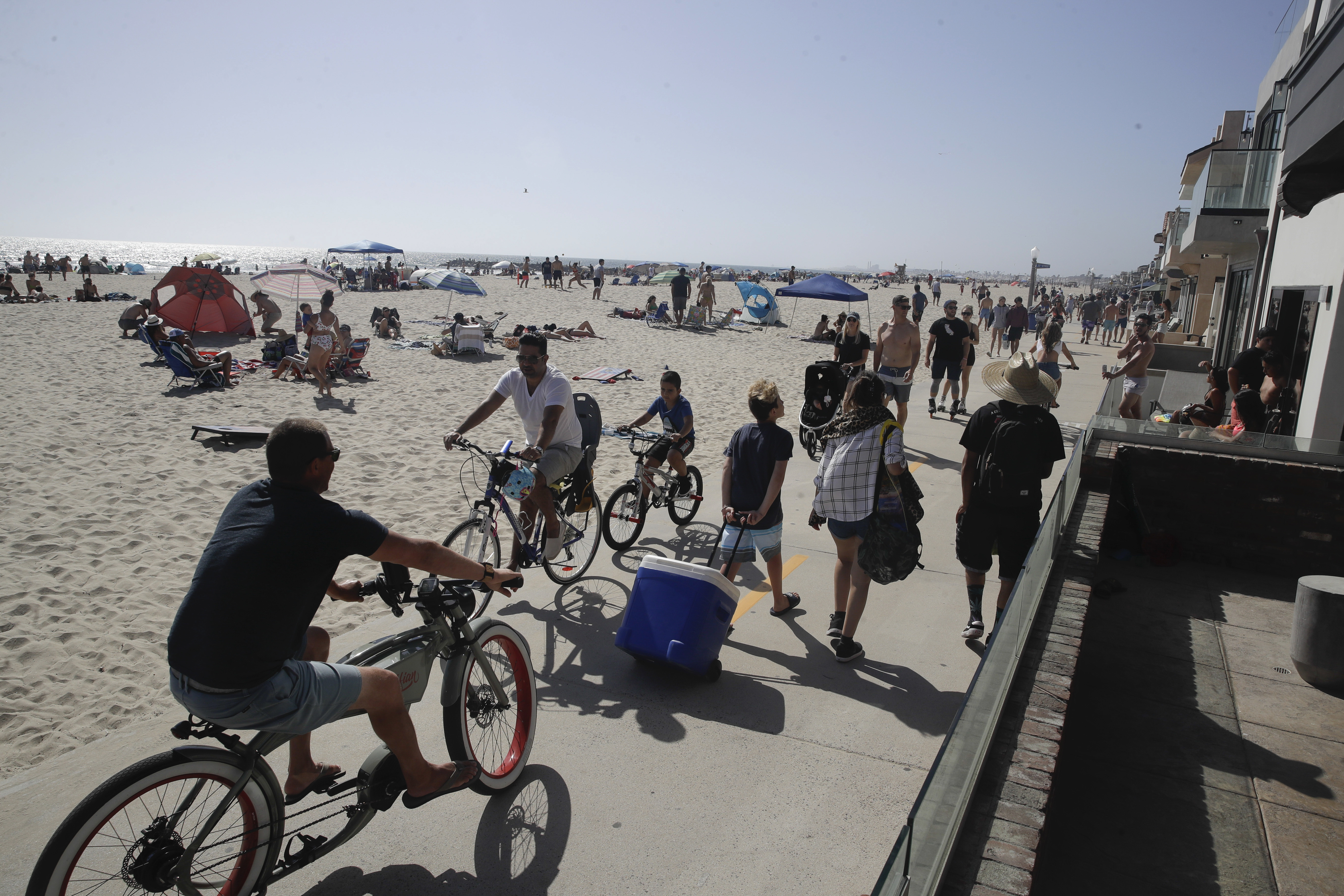 Visitors used a biking and walking path Sunday in Newport Beach, Calif.
