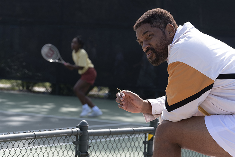 Richard Williams (Will Smith) watches Venus (Saniyya Sidney) play tennis in "King Richard." MANDATORY CREDIT: Chiabella James / Warner Bros.  Pictures.