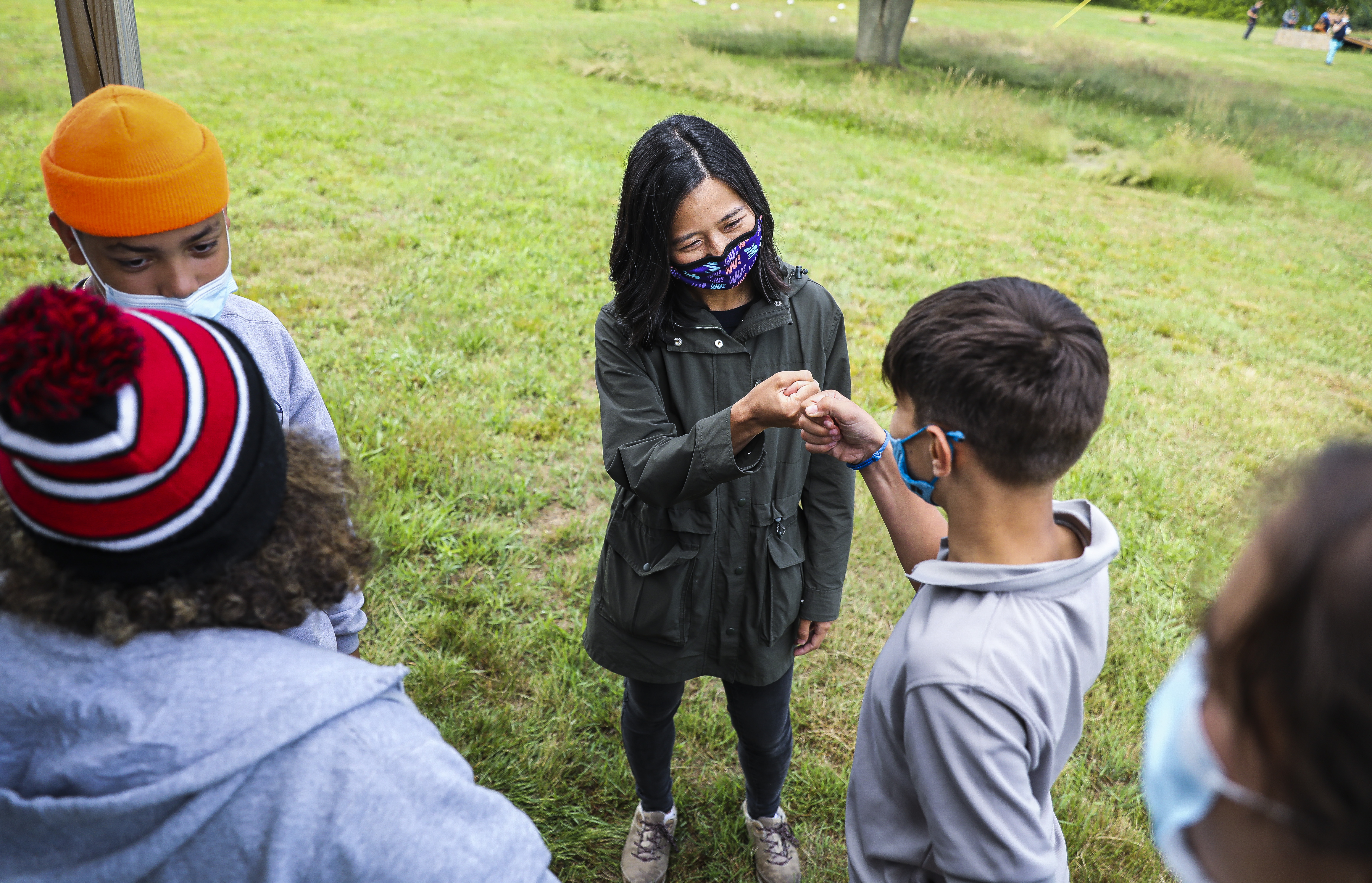 Michelle Wu chatted with summer camp attendees while visiting Thompson Island.