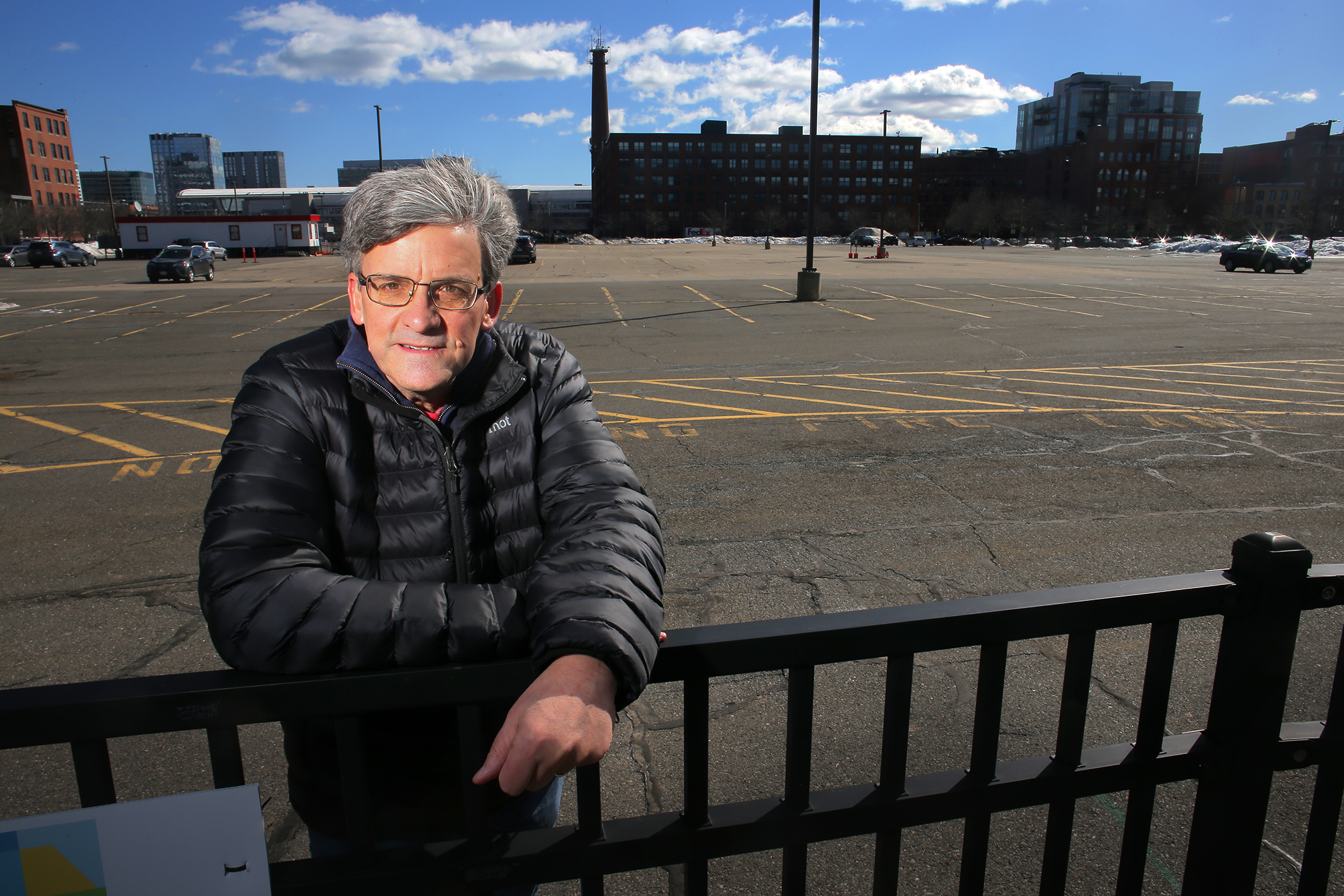 Resident Tom Ready stood in a parking lot slated for development.