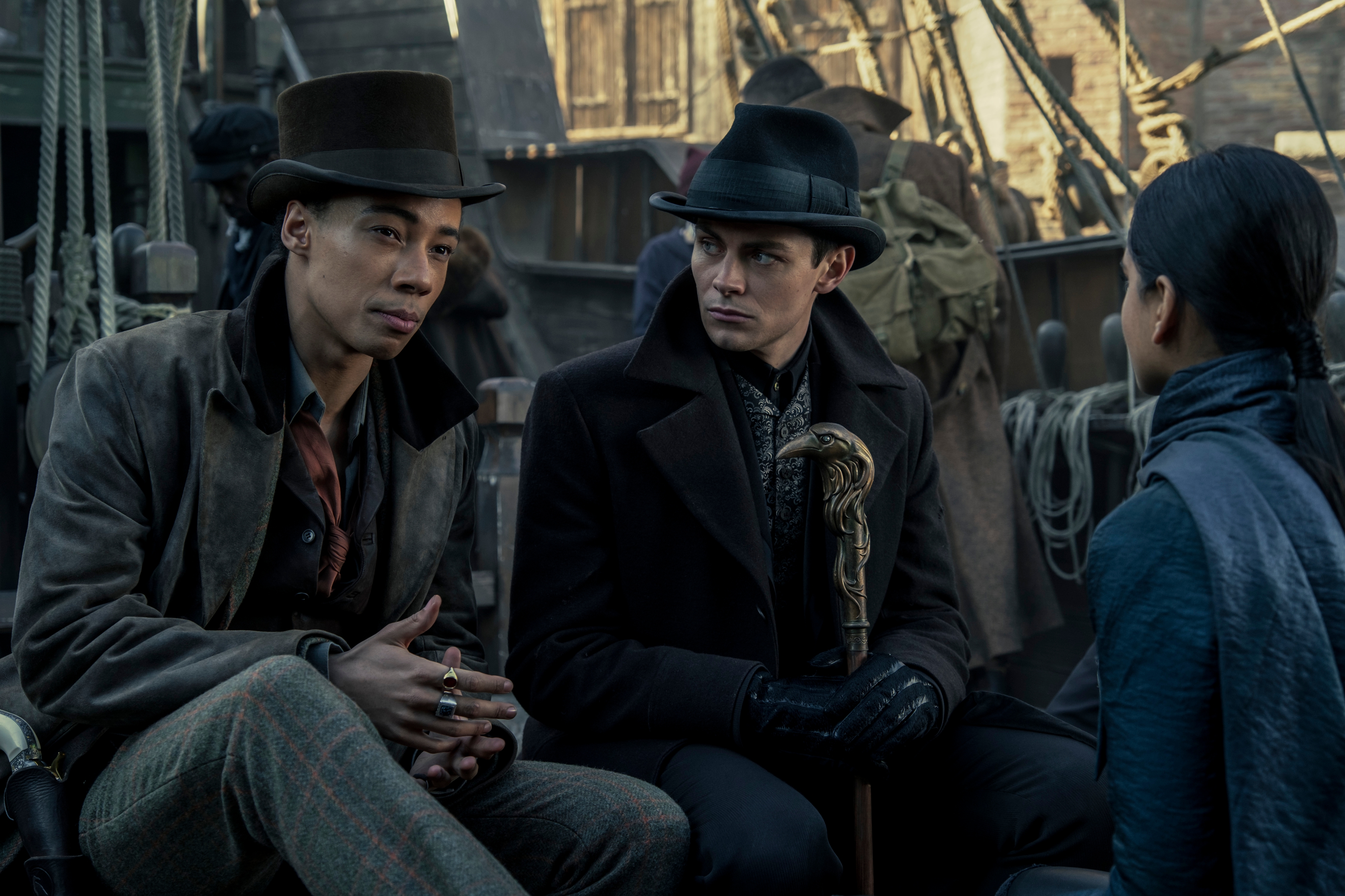 From left: Kit Young As Jesper Fahey, Freddy Carter as Kaz Brekker, and Amita Suman as Inej Ghafa in Netflix's "Shadow and Bone."
