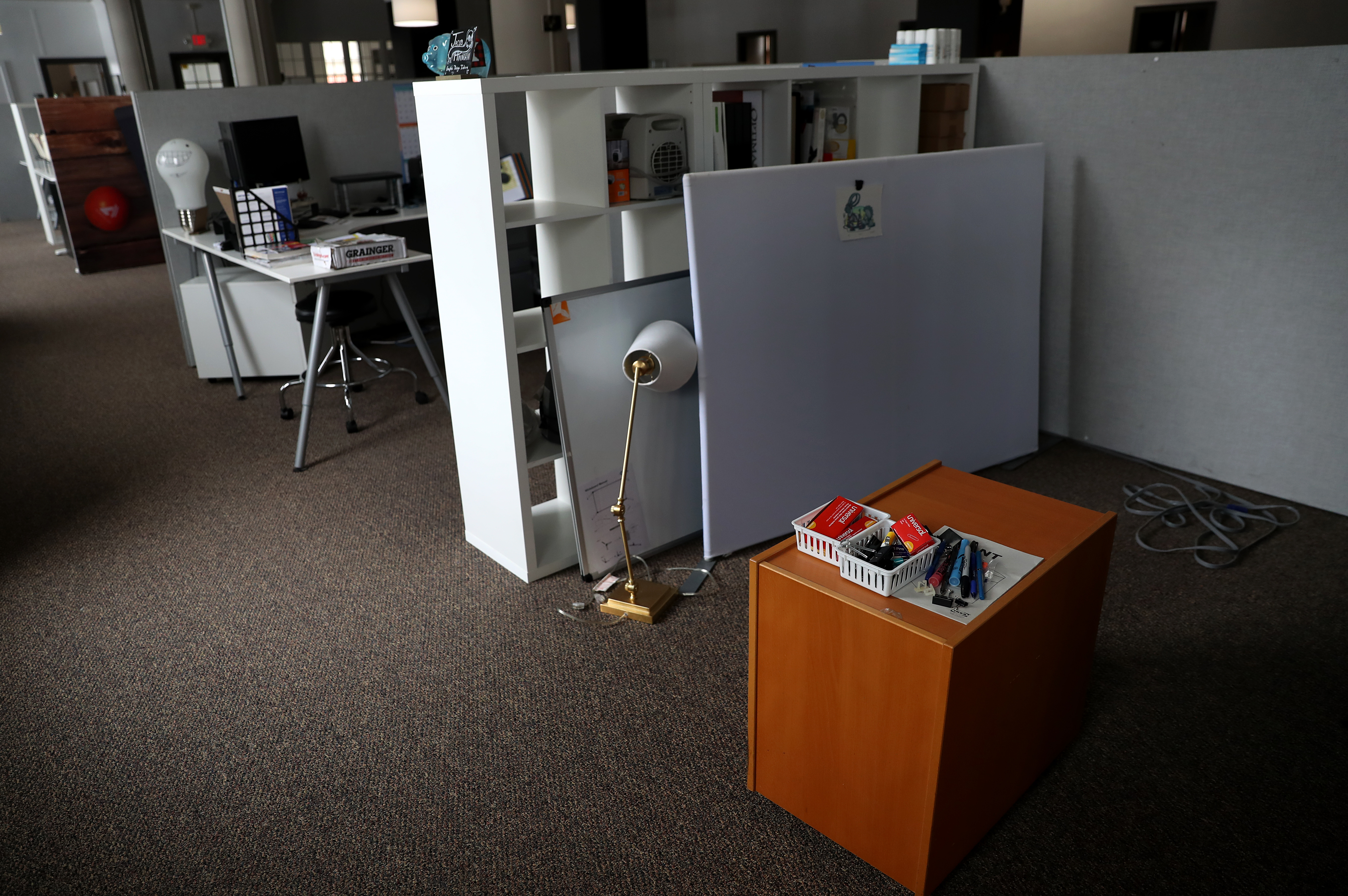 Cubicles sit empty in the Access TCA office space.