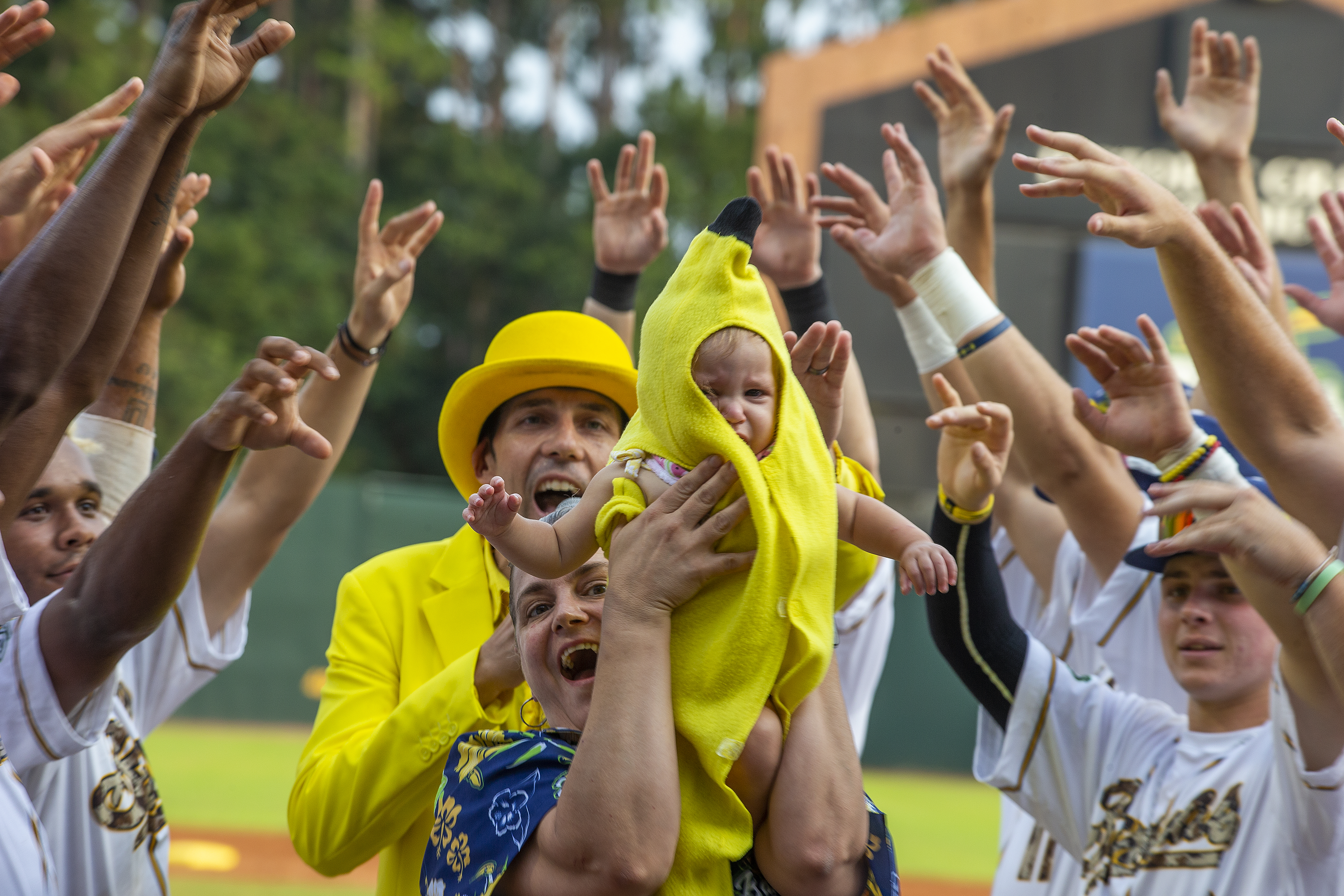 A baby is honored as the "Banana Baby" prior to the game.