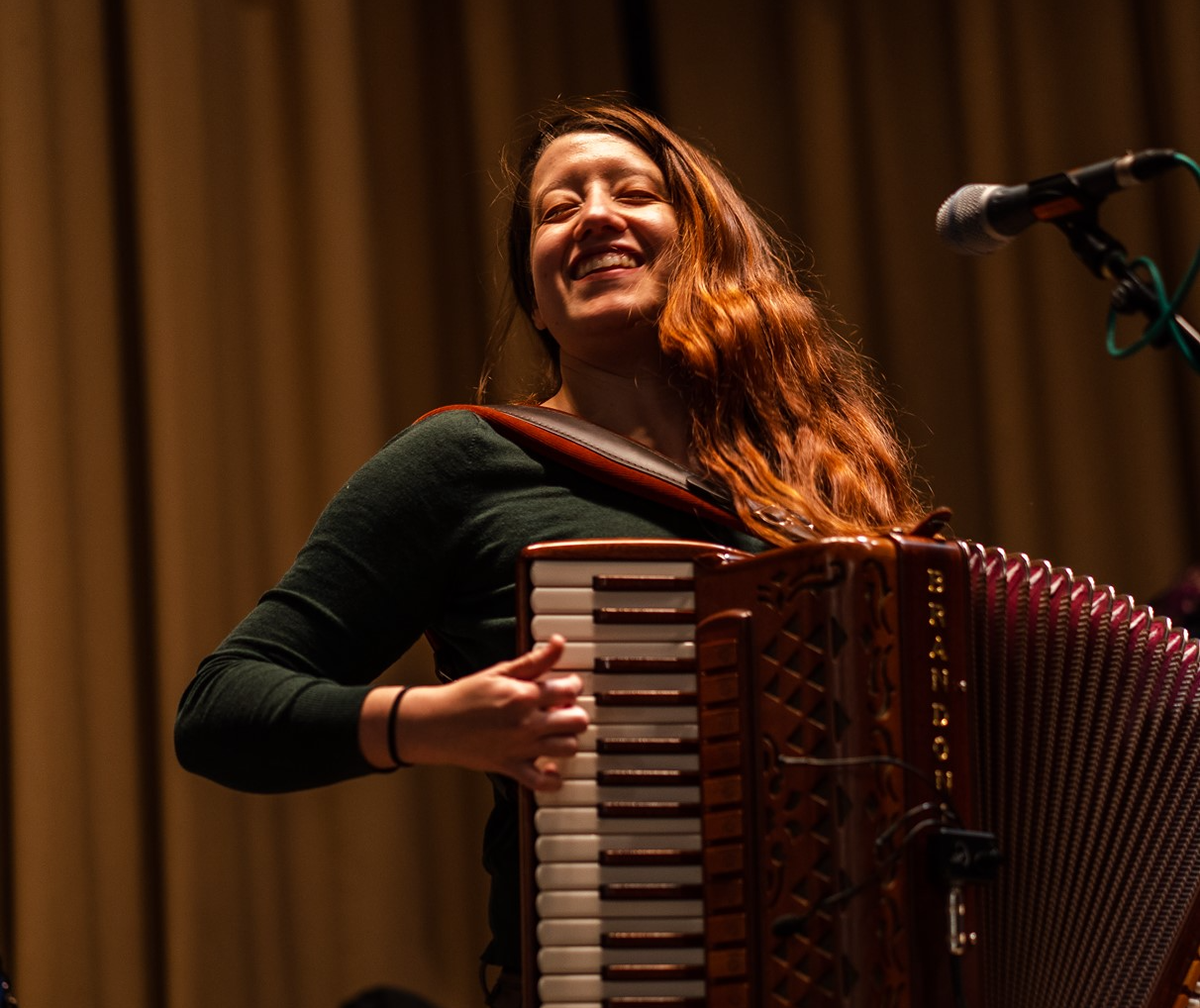 AZ Madonna playing the accordion at the Concord Scout House with the Chimney Swift dance group.