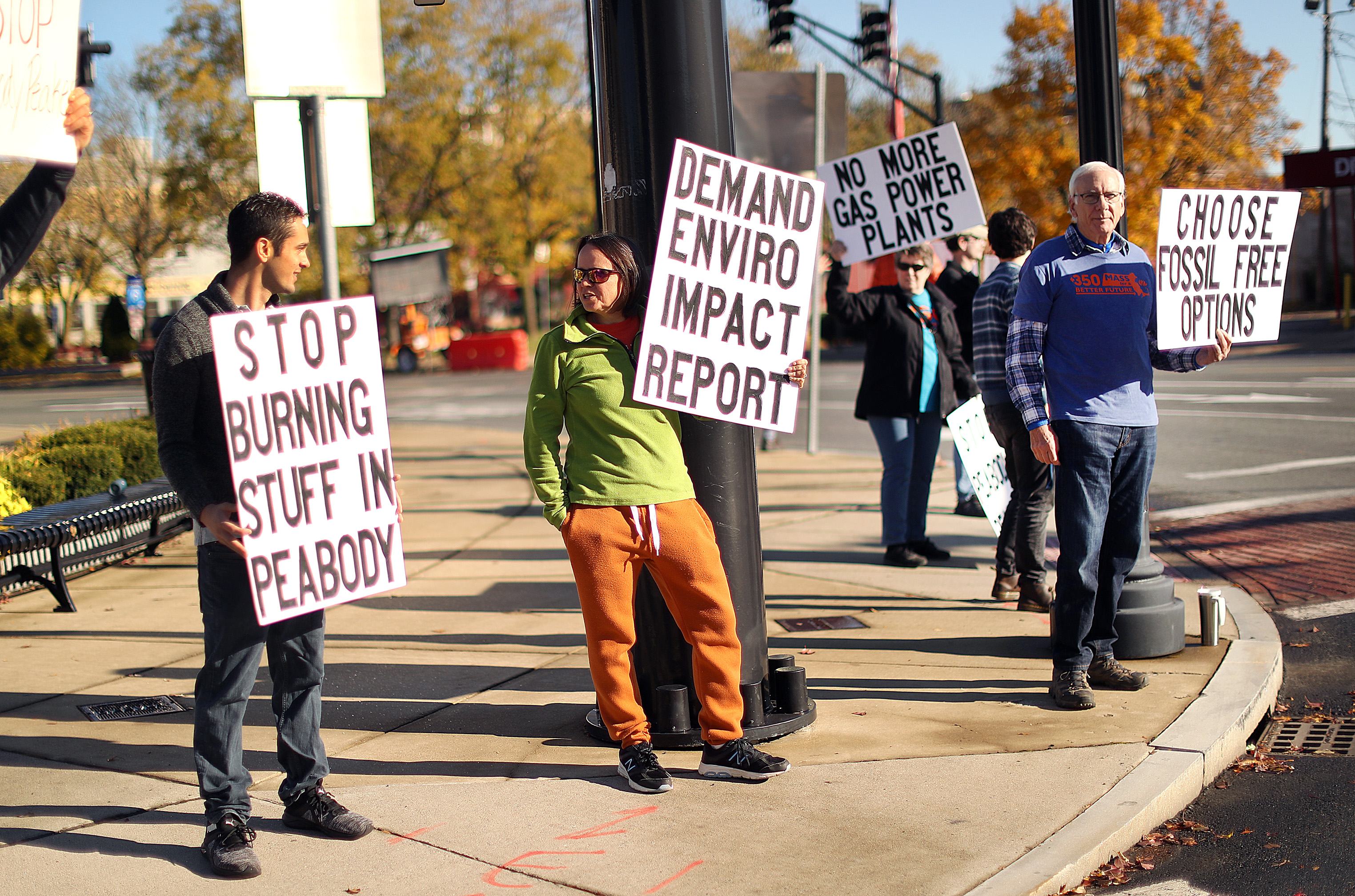 Local residents protested in Peabody Square Saturday morning a proposal to build an a new gas and oil-based power "peaker" plant in Peabody next to an existing power plant.