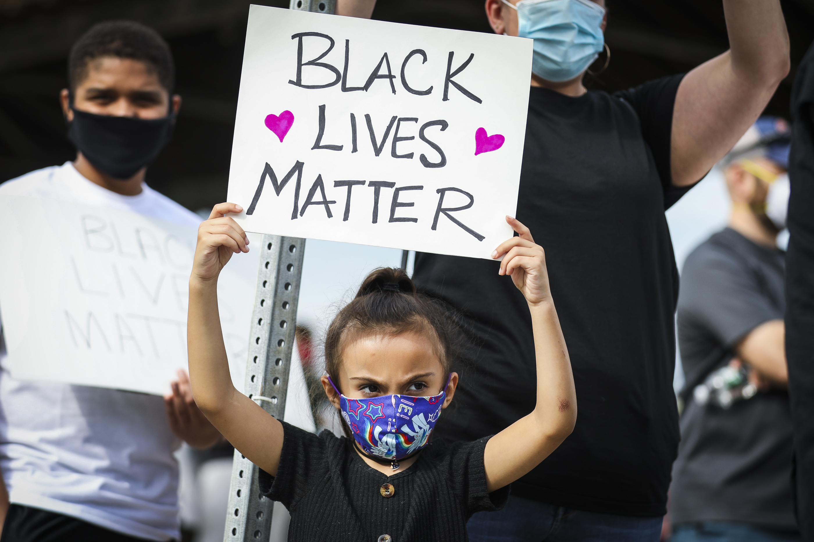 Sophia Llanos, 6, held up a Black Lives Matter sign at the protest.