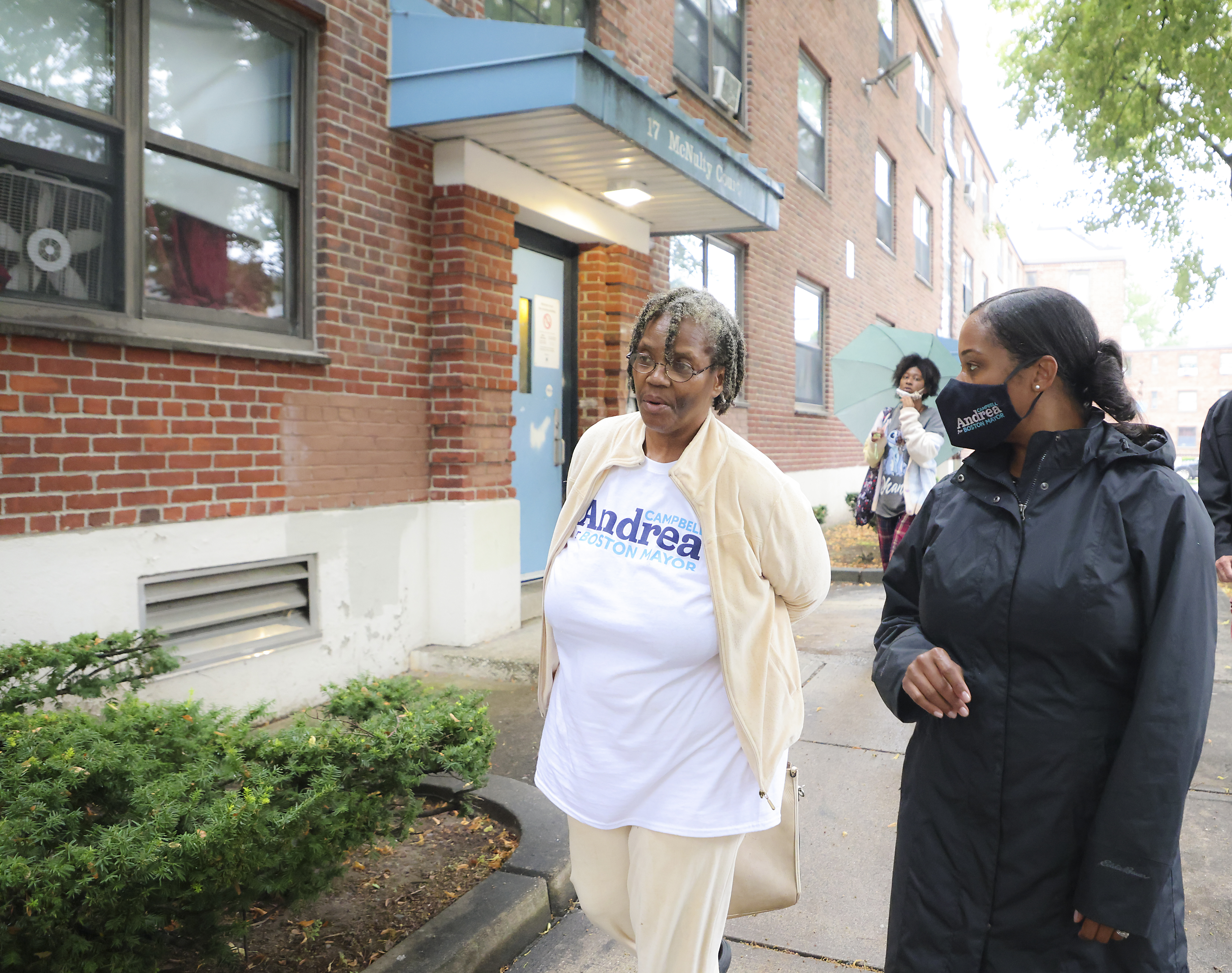 Andrea Campbell campaigned in the Charlestown Apartments with Betty Carrington.