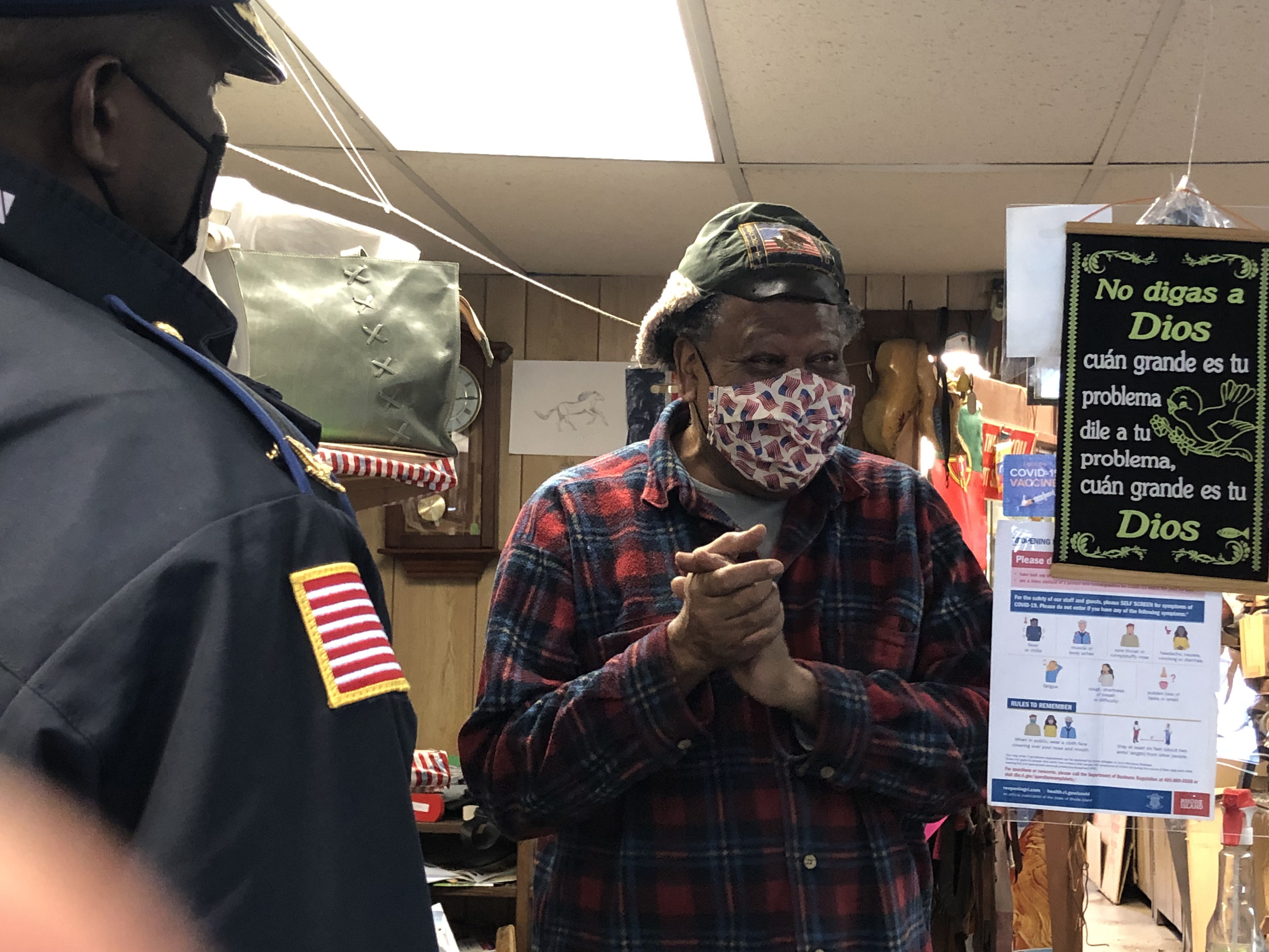 On a walk through Central Falls with the new mayor, Roberson meets Abraham Hernandez, owner of Tony’s Shoe Service.