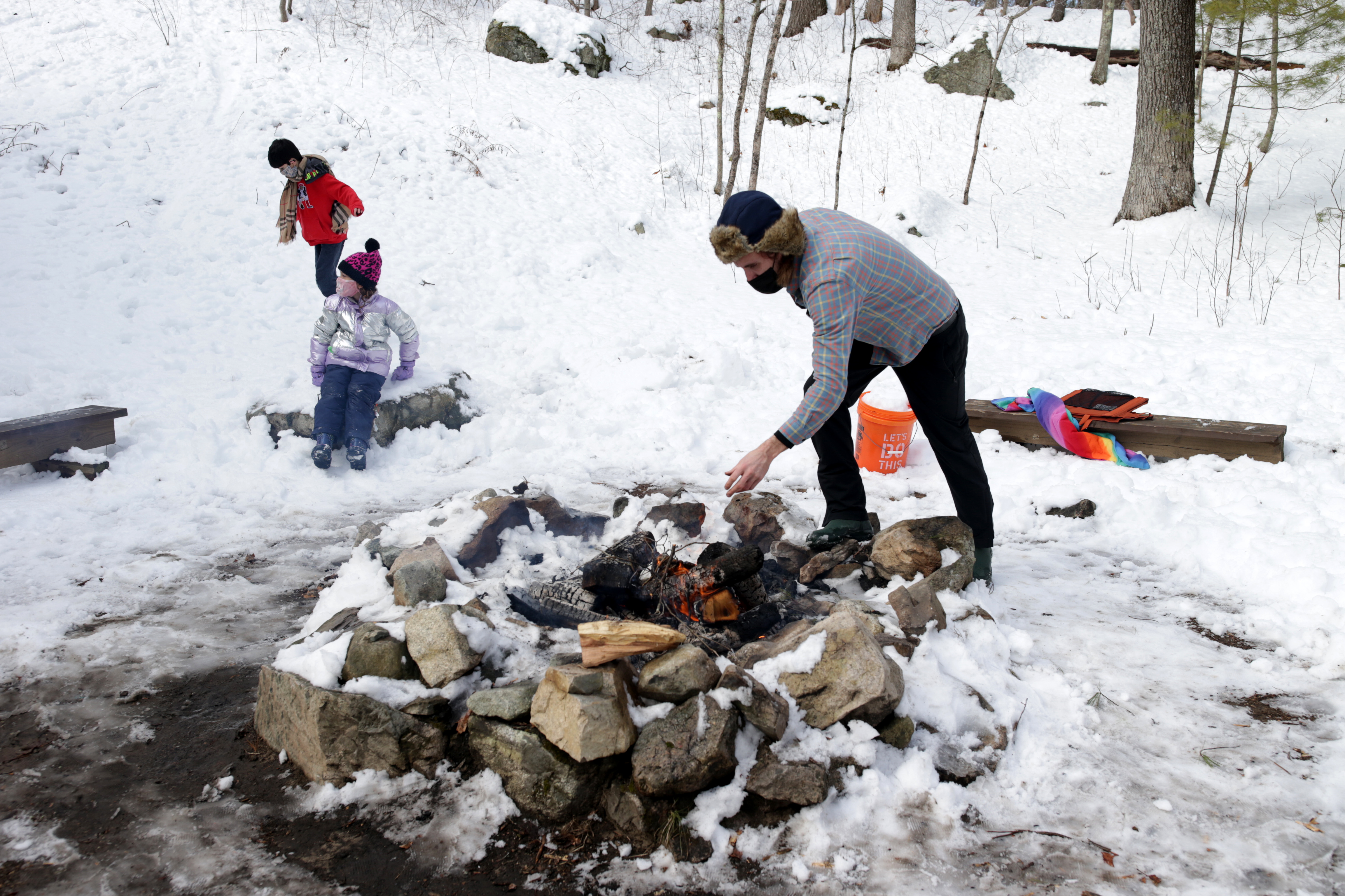 Erik Phelan tended to an afternoon campfire.