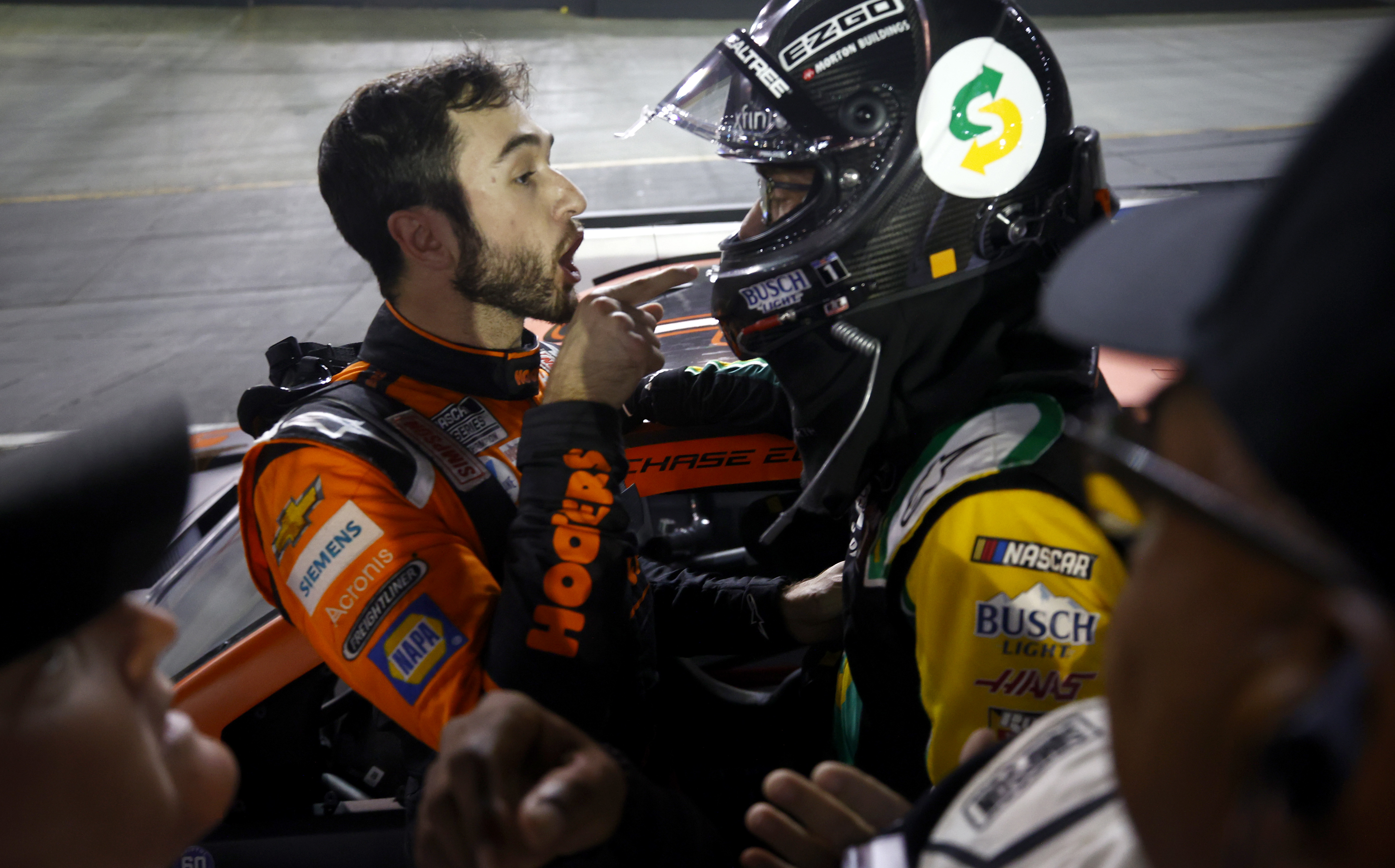 Tempers flared between Chase Elliott (left), the reigning NASCAR Cup Series champion, and runner-up Kevin Harvick (right) during their post-race confrontation on pit road.
