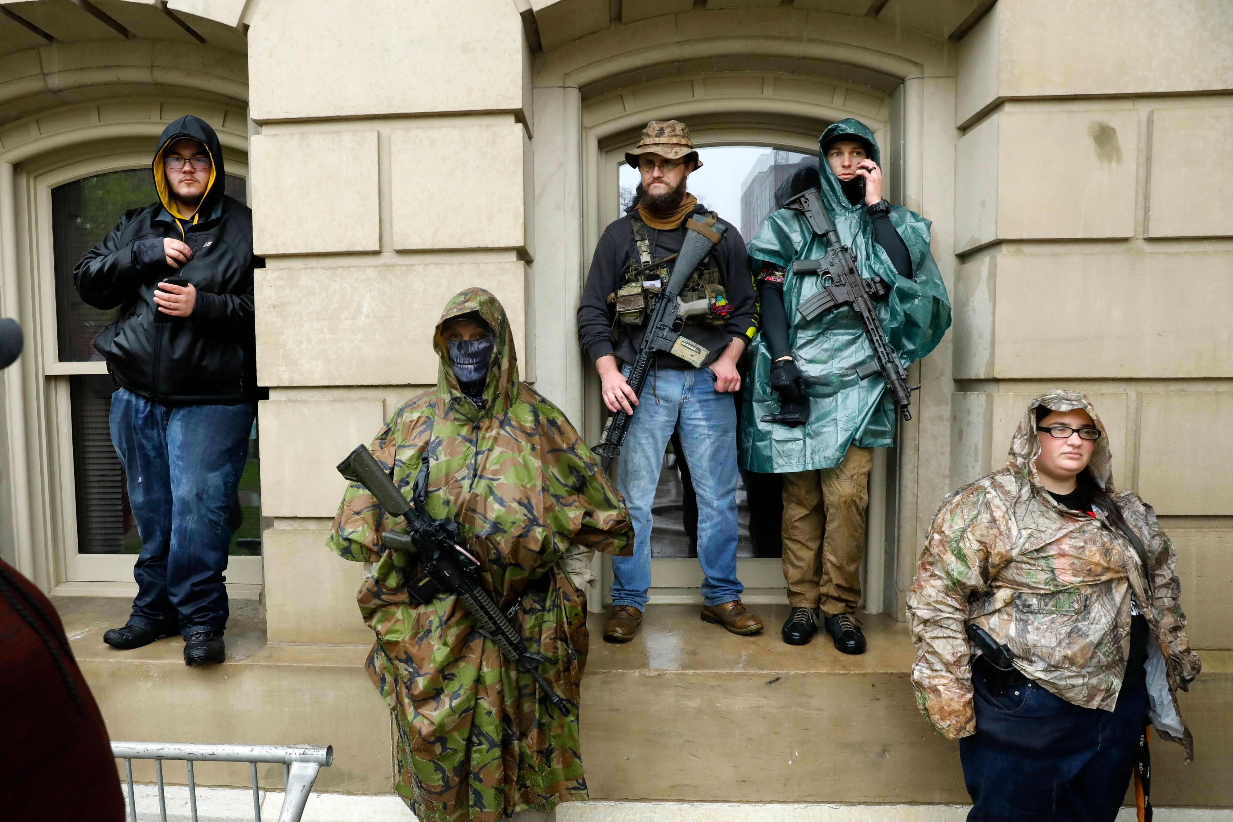 Armed demonstrators in Lansing, Michigan, protest the coronavirus pandemic stay-at-home orders on May 14.