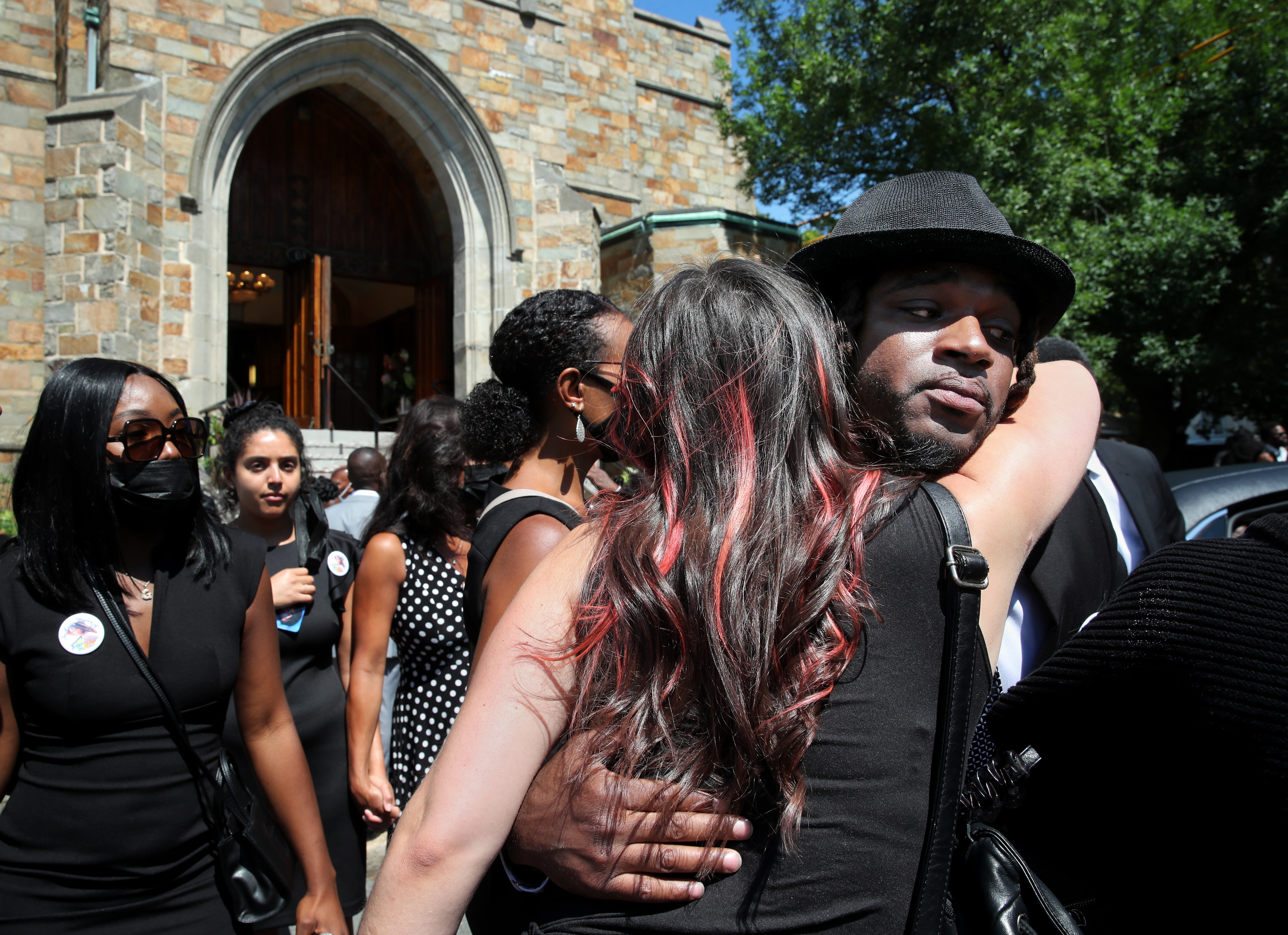 Wilvens Julce was comforted by friends and family following his sister Jeanica's funeral in Somerville on Saturday.