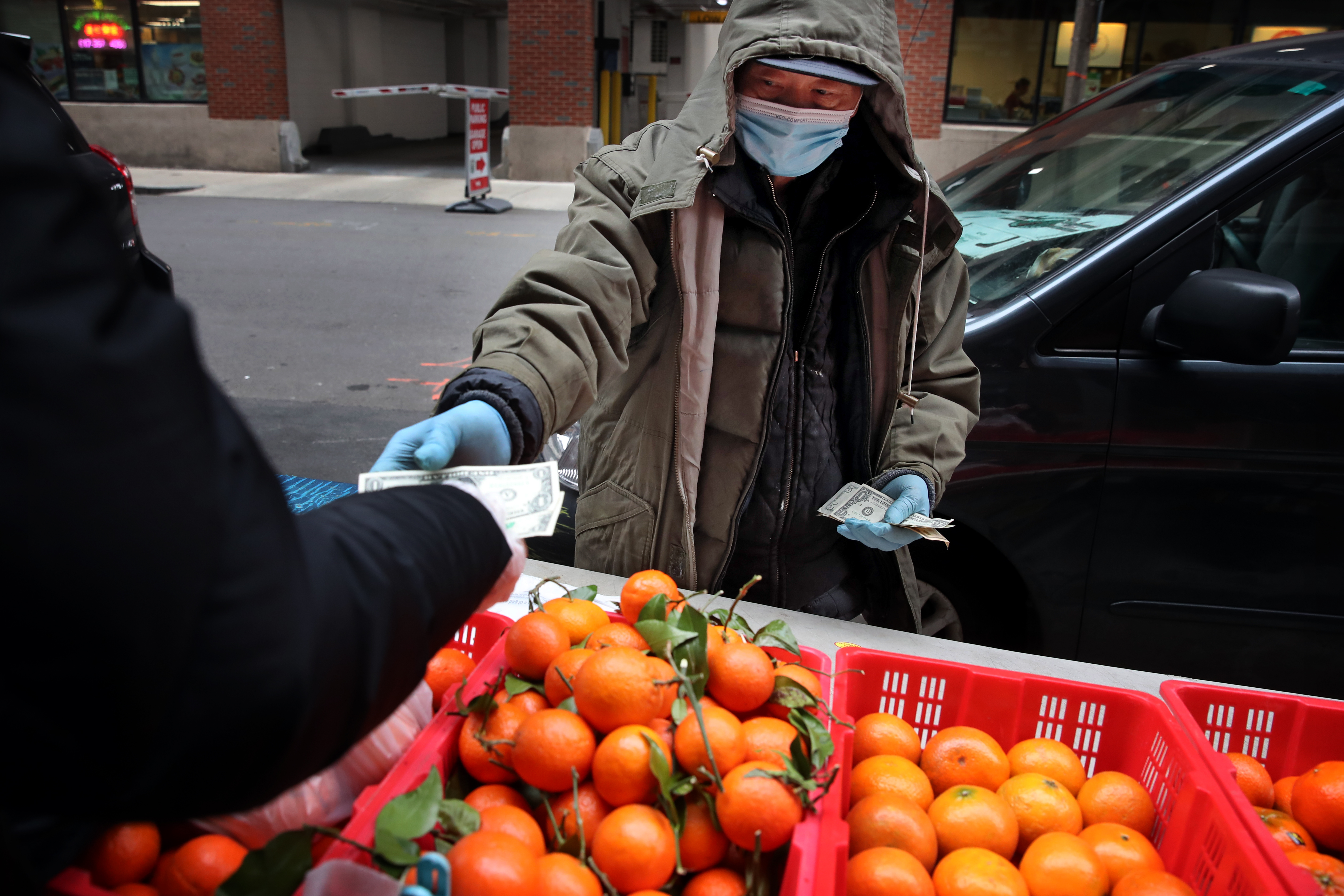 Street vendor Ton Wu sells fruit in Chinatown.