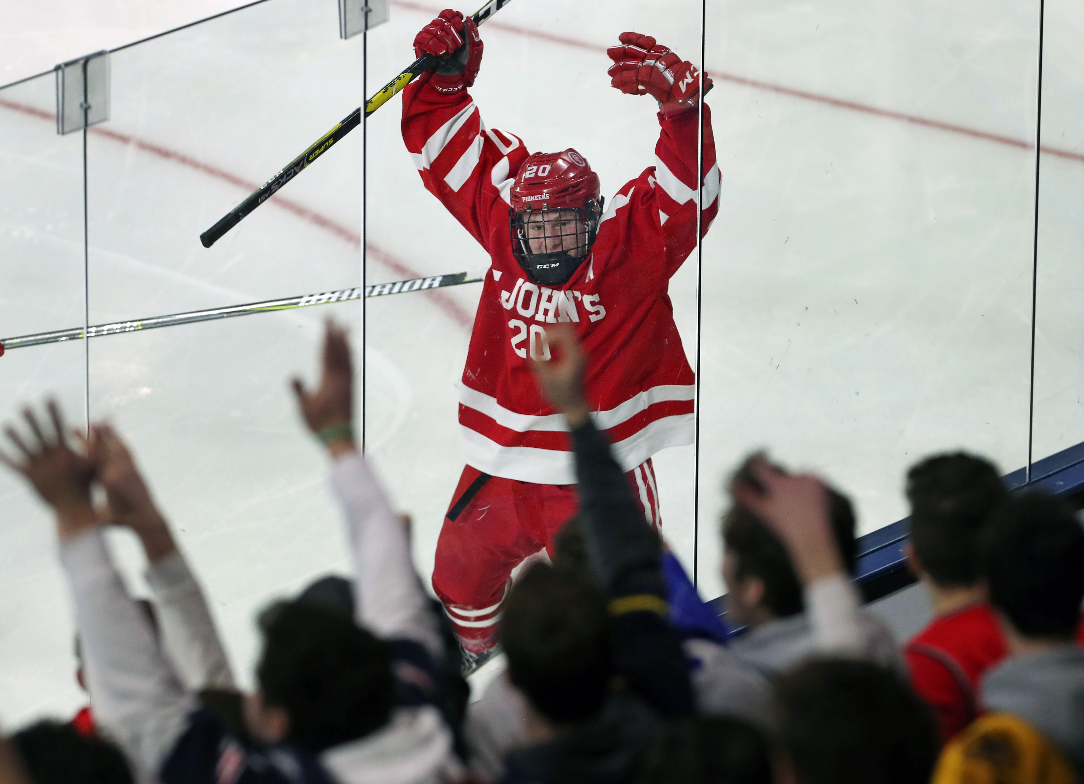 St. John’s of Shrewsbury player Sean Clark celebrated with his team’s fans after he scored in the third period to put his team ahead 3-1 over Westford Academy in the Division 1 North boys’ hockey semfinal at Tsongas Arena.