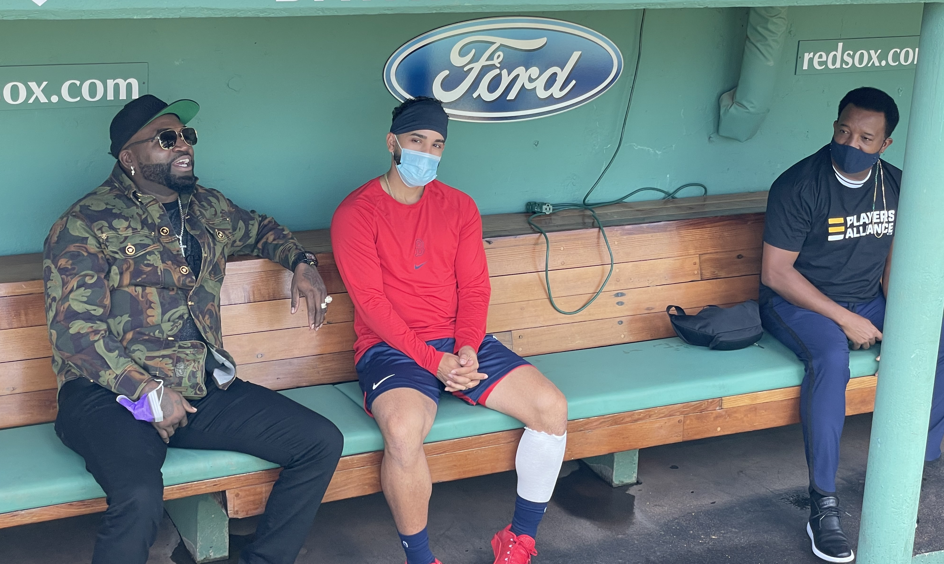 Red Sox infielder Jack Lopez (center) was joined by David Ortiz (left) and Pedro Martinez (right) in the dugout prior to Boston's game on Saturday.