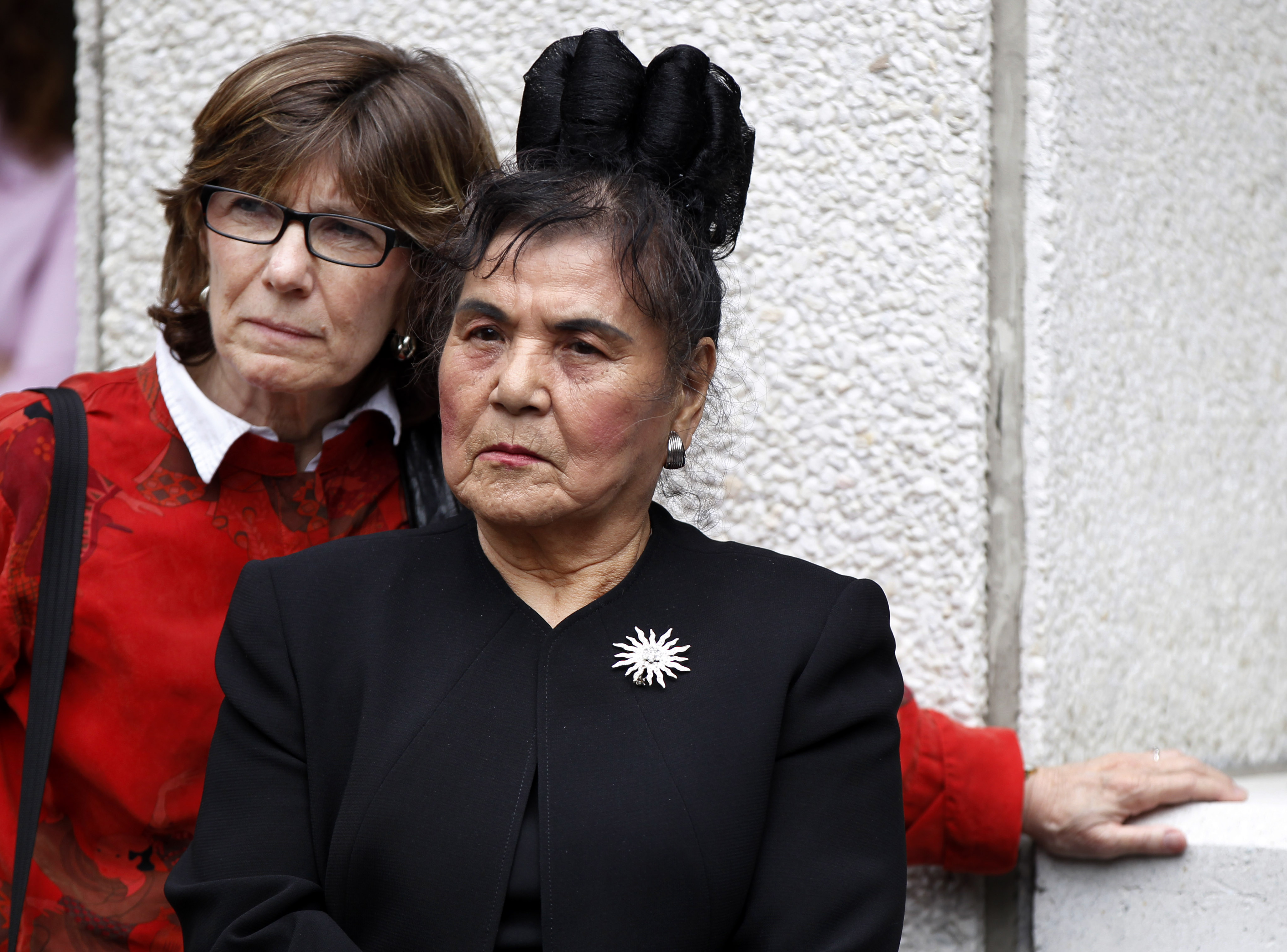 Mary Howell (left), with Fuki Madison in April 2012, after police officers who had killed Madison's son and other New Orleans residents were sentenced.
