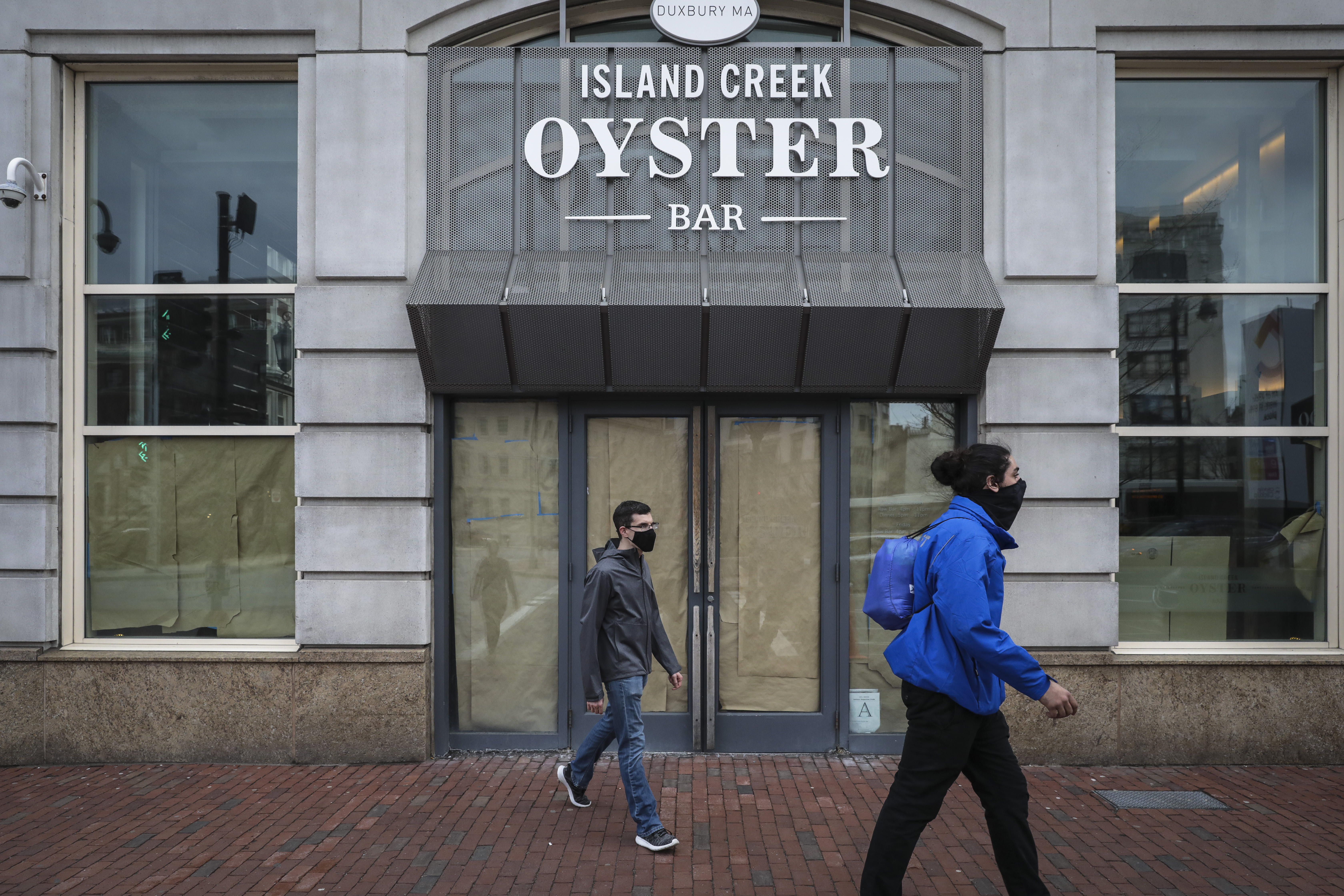 Cardboard and paper was used to cover up the windows of Island Creek Oyster Bar after owners were forced to close.
