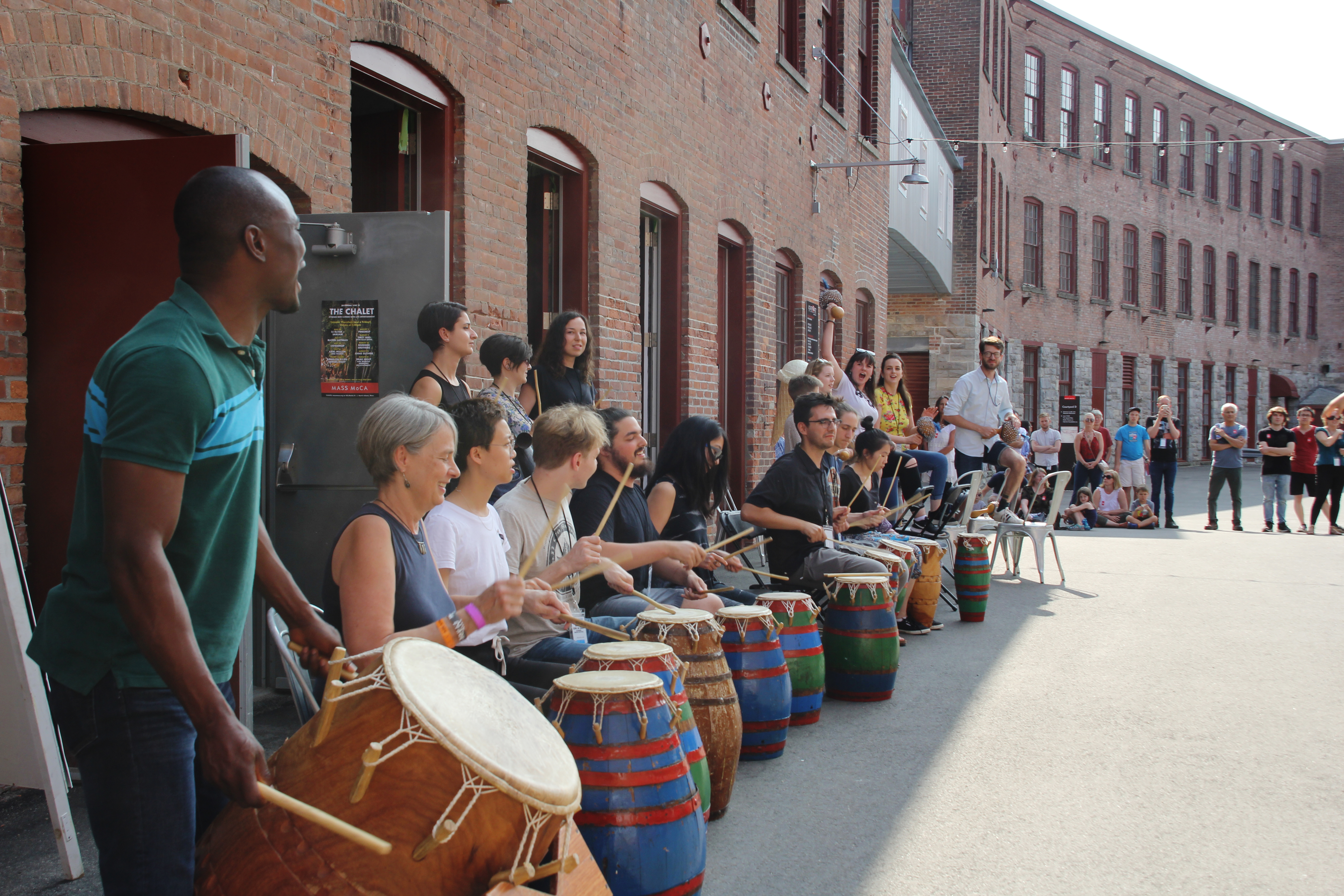 Nani Agbeli, at left, led a Ghanaian drumming performance at Courtyard D during Bang on a Can's 2018 summer music festival.