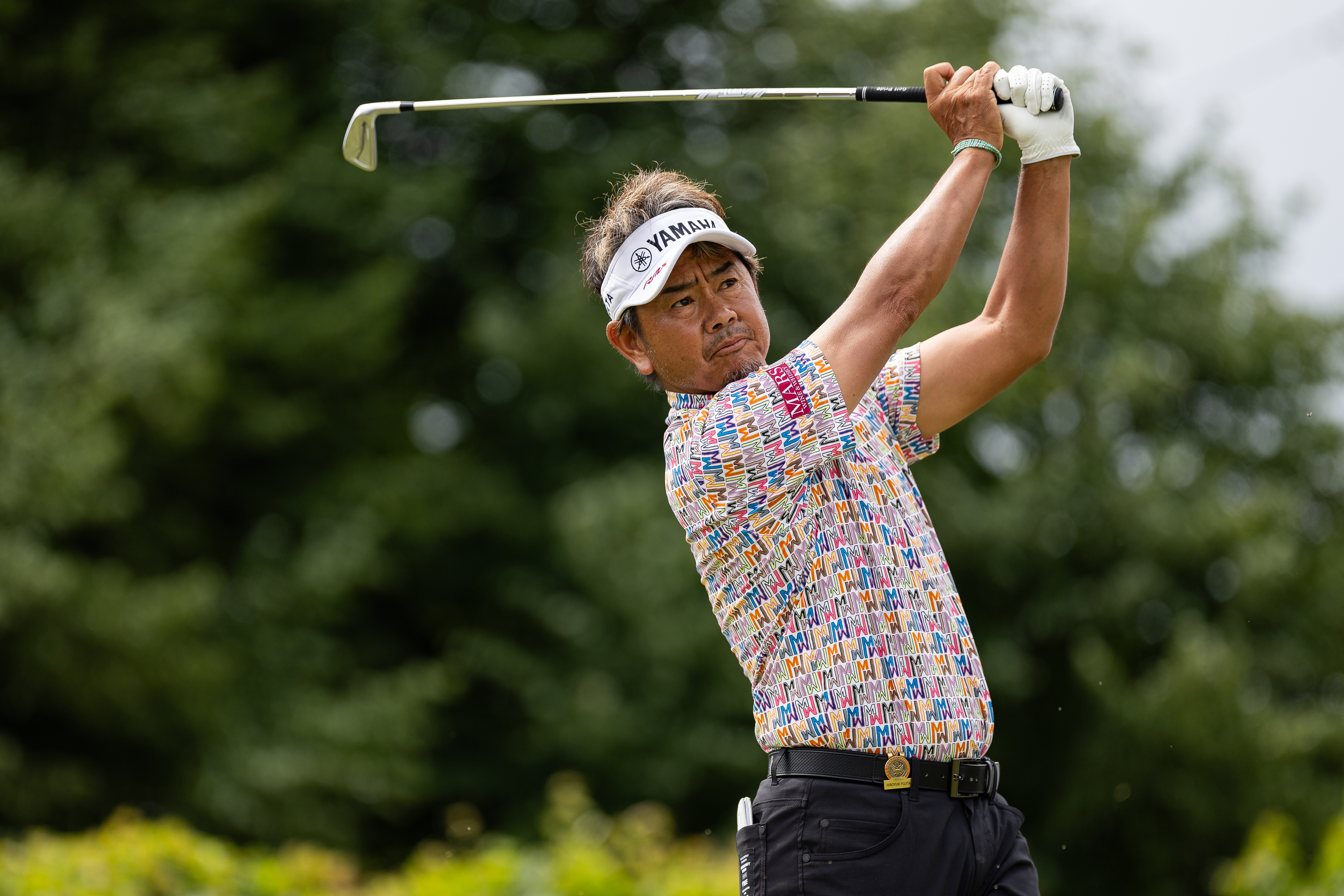 Hiroyuki Fujita handles the blows at Newport Country Club, carries