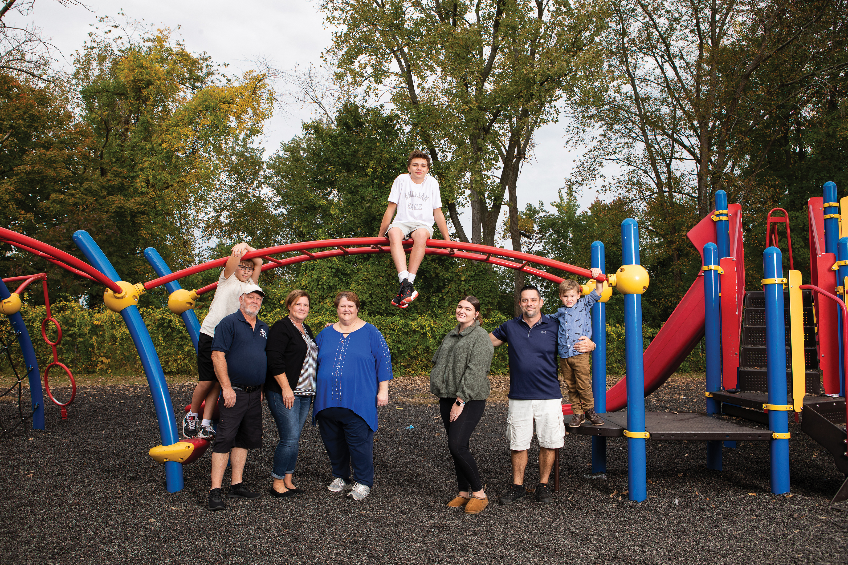 From left: Nate (standing on the monkey bars); Rick and Ann Knight; Lori Cognac, program director; Gabe (sitting on the monkey bars); Alyssa, the Knights’ granddaughter; Kenneth Goodrich, martial arts instructor; and Kayden.
