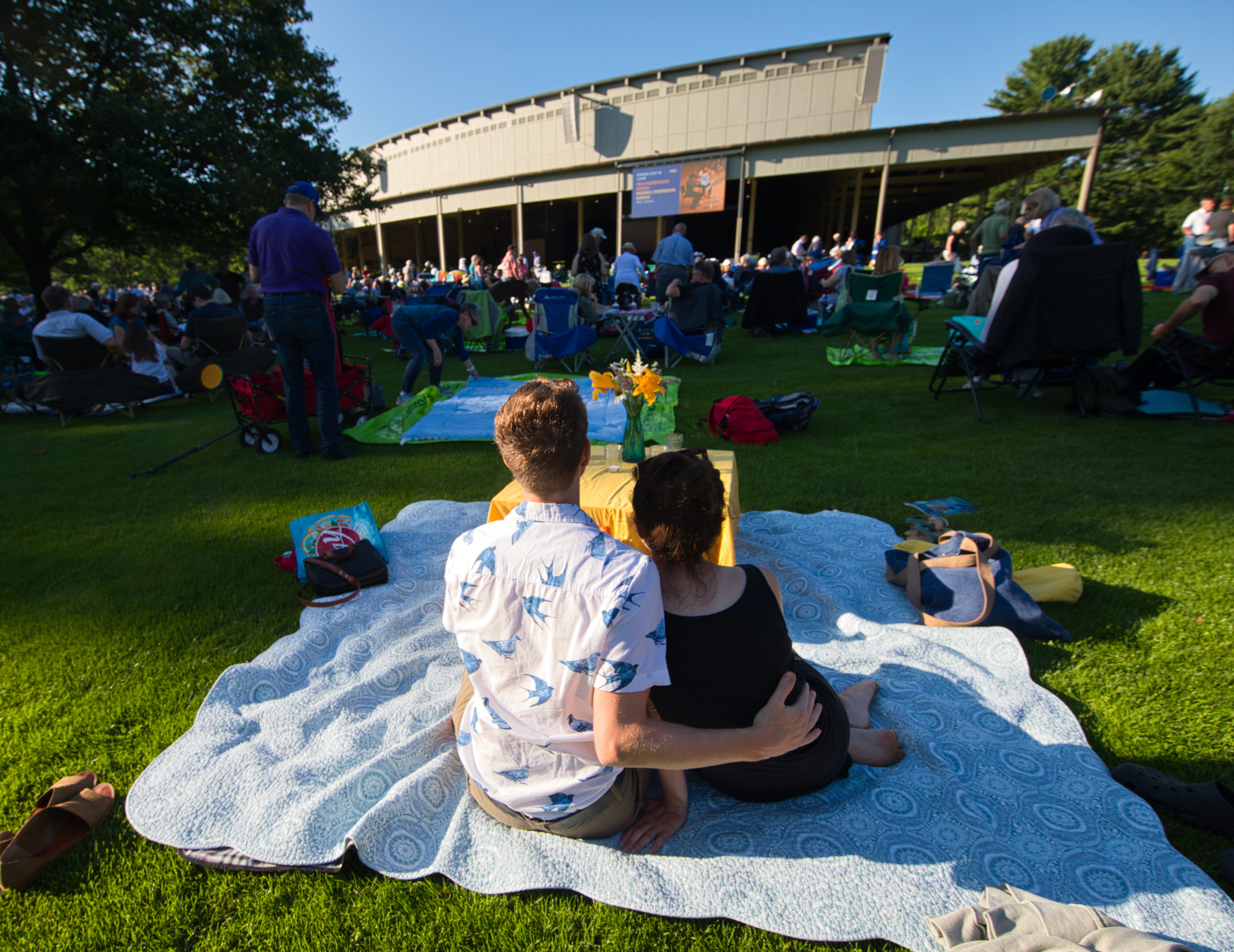 A couple took in music from the lawn last weekend at Tanglewood.
