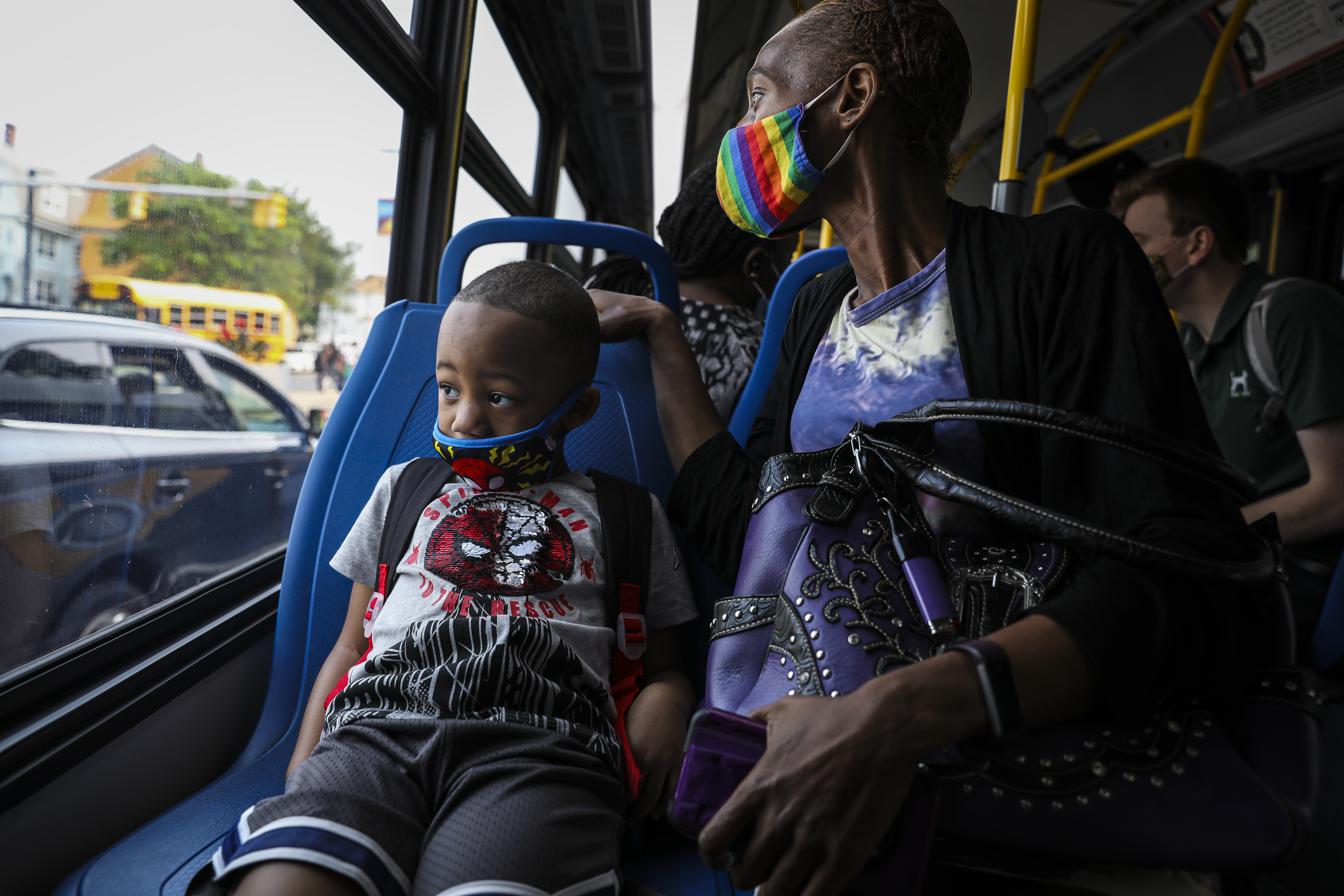Four-year-old Vaunyèe looked out the window while riding on the bus with his mom Vernèe St. Cyere.