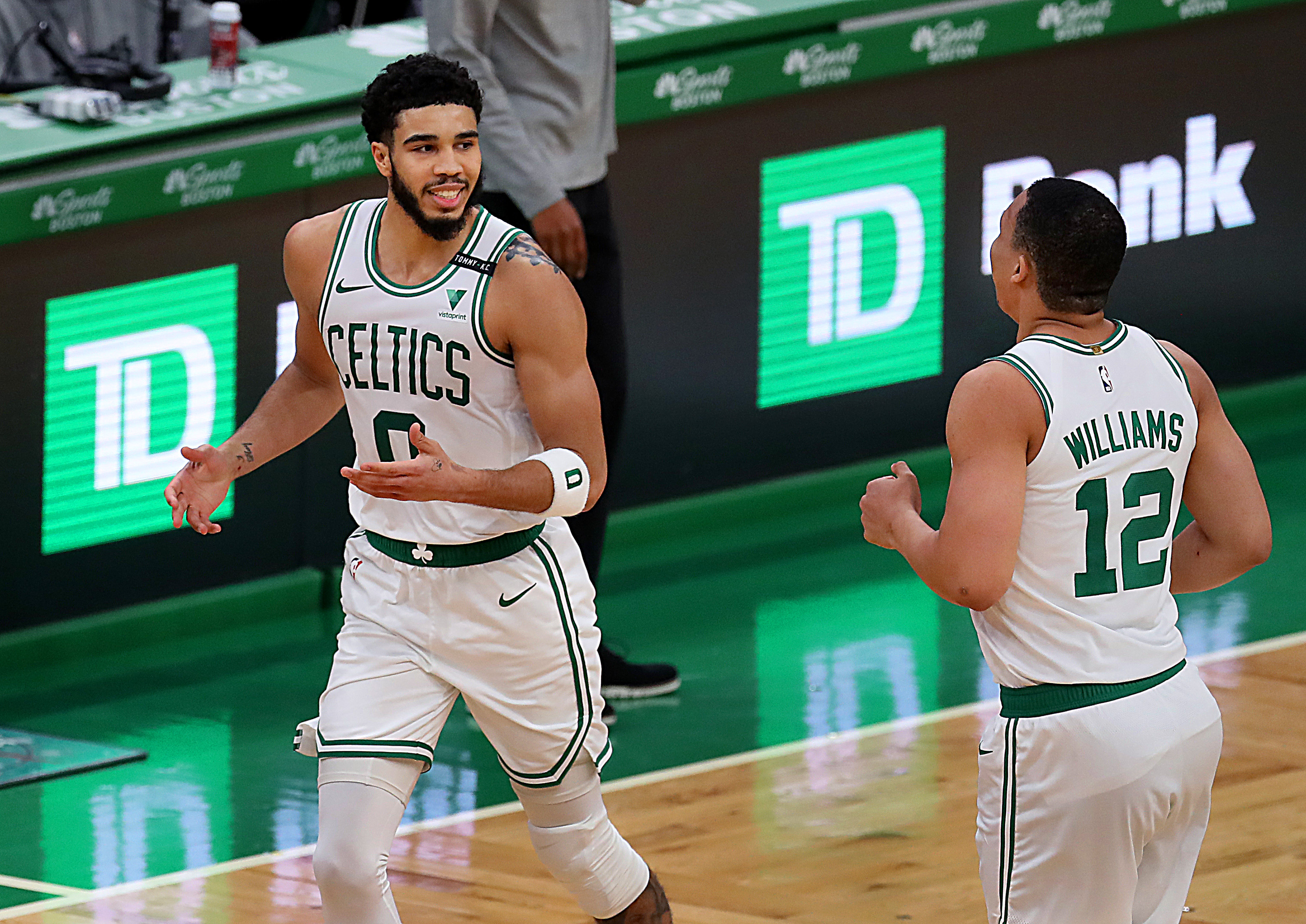 Jayson Tatum and Grant Williams smile after a bucket in a game against Houston earlier this month.