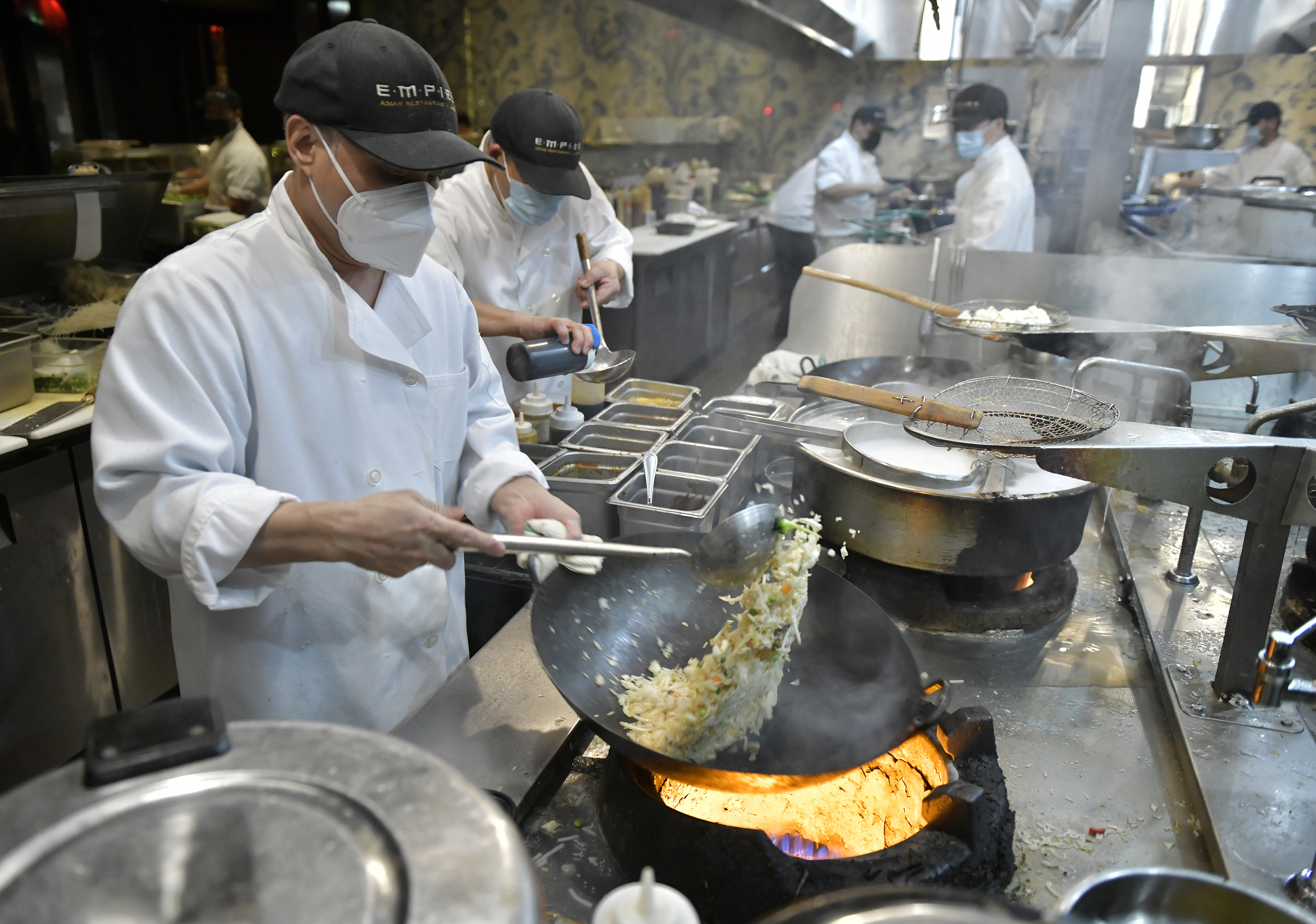 The kitchen at Empire in the Seaport District, one of Big Night's reopened properties, in March. Big Night put its employees with the most need back to work first.