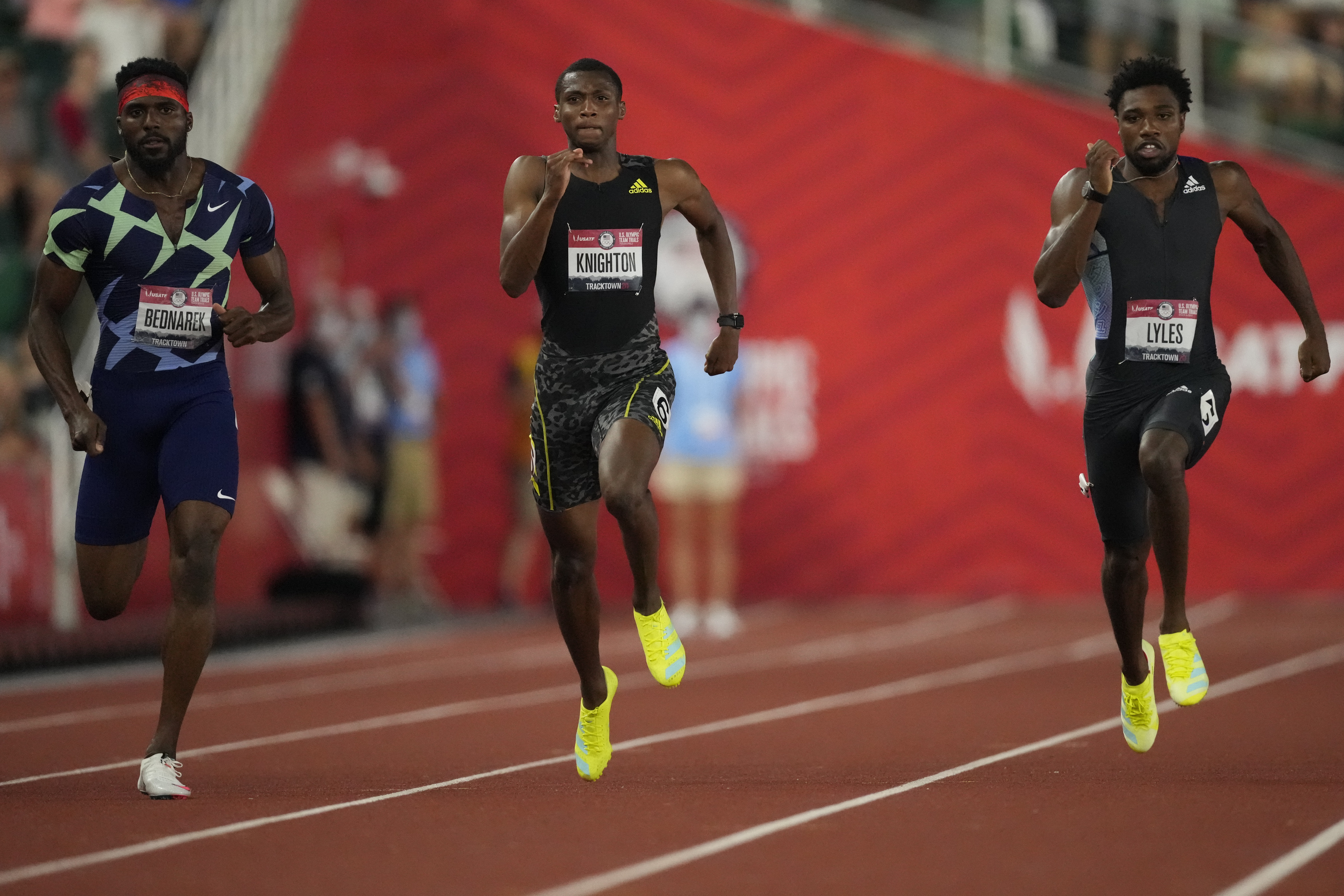 Teenager Erriyon Knighton, center, brings electric speed to Tokyo.