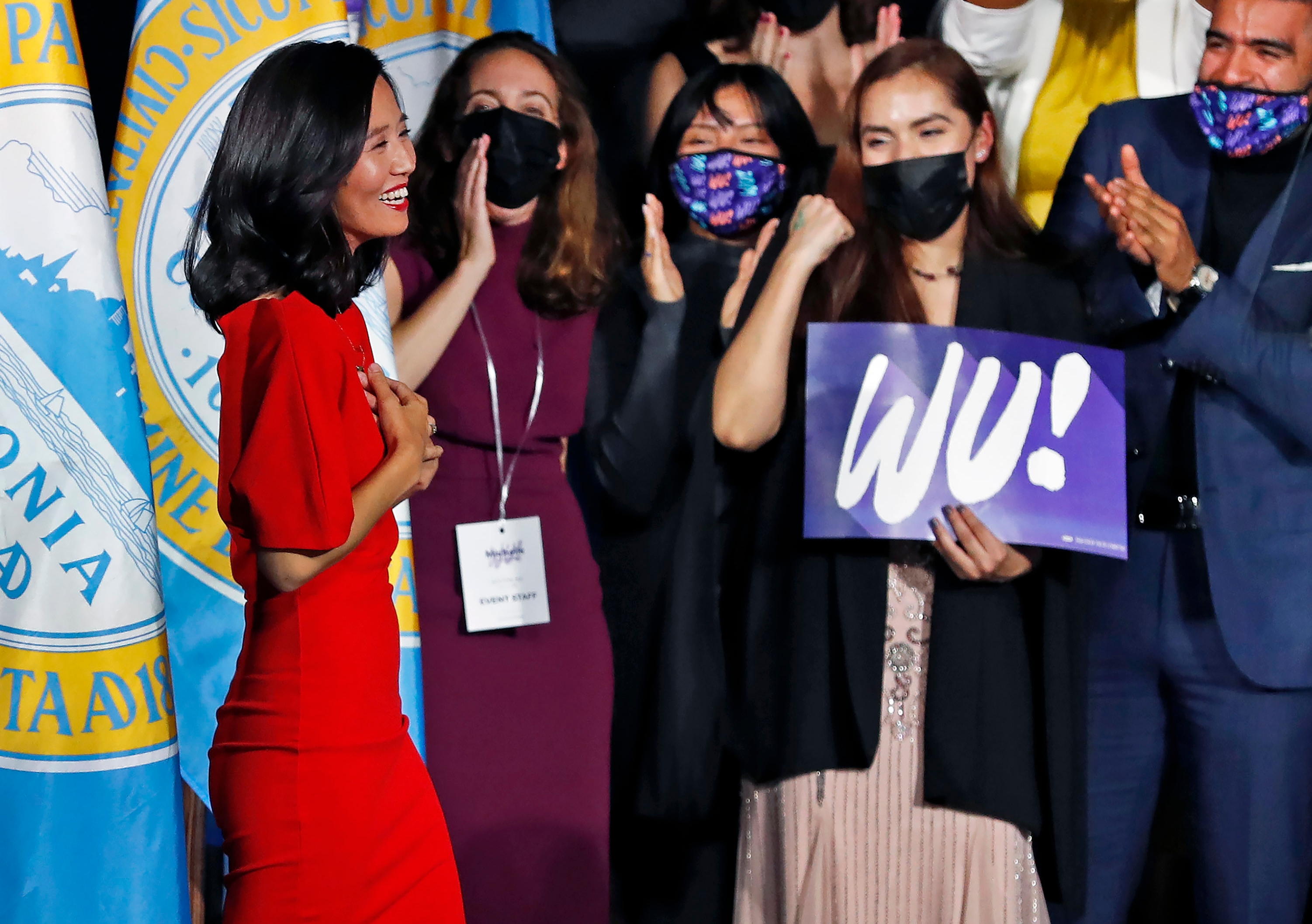 Following her victory in the Boston mayoral race, Michelle Wu reacted to the cheers as she took the stage to speak to supporters at her victory party.