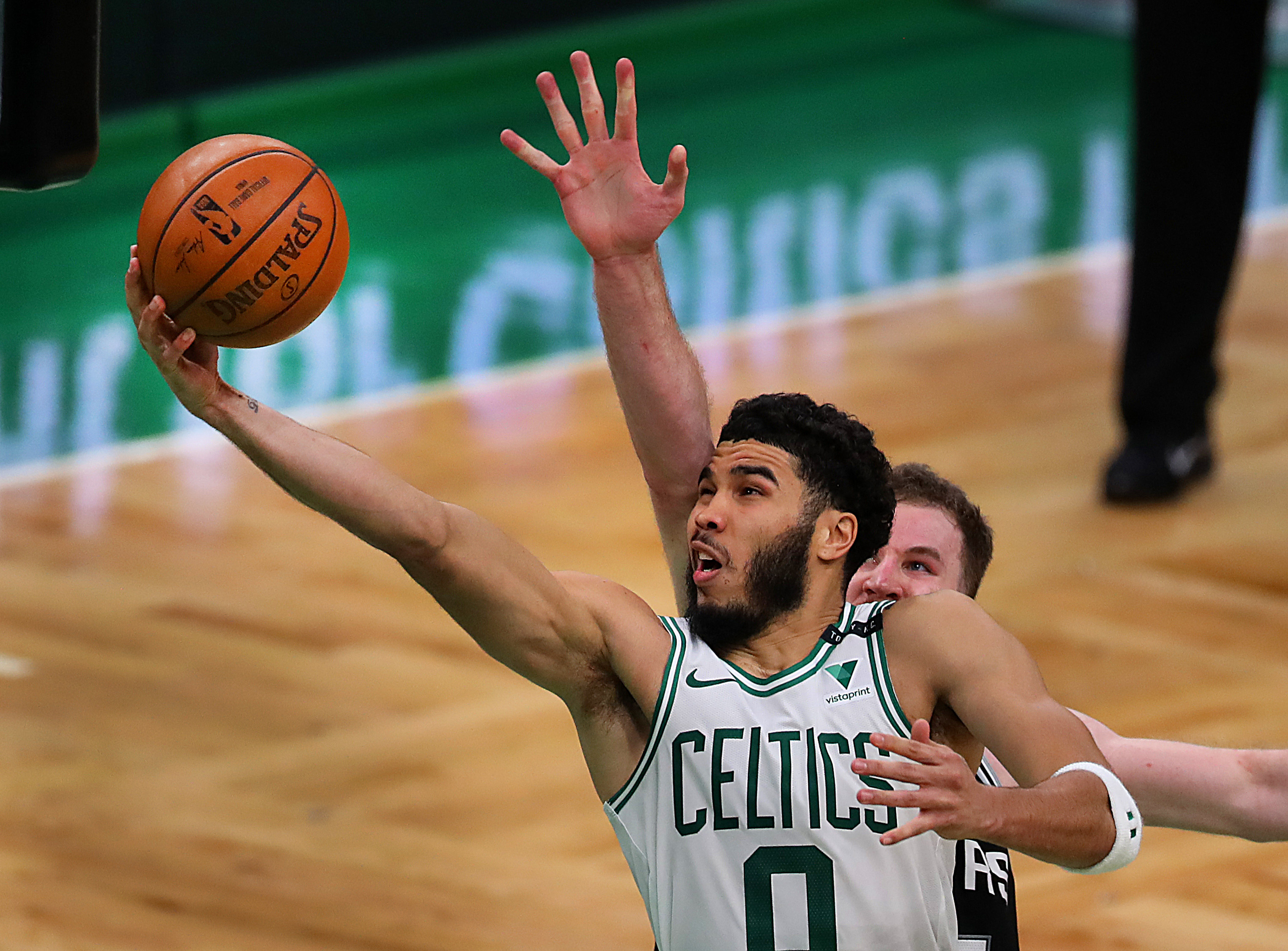 Jayson Tatum wore these awesome Larry Bird-themed shorts to