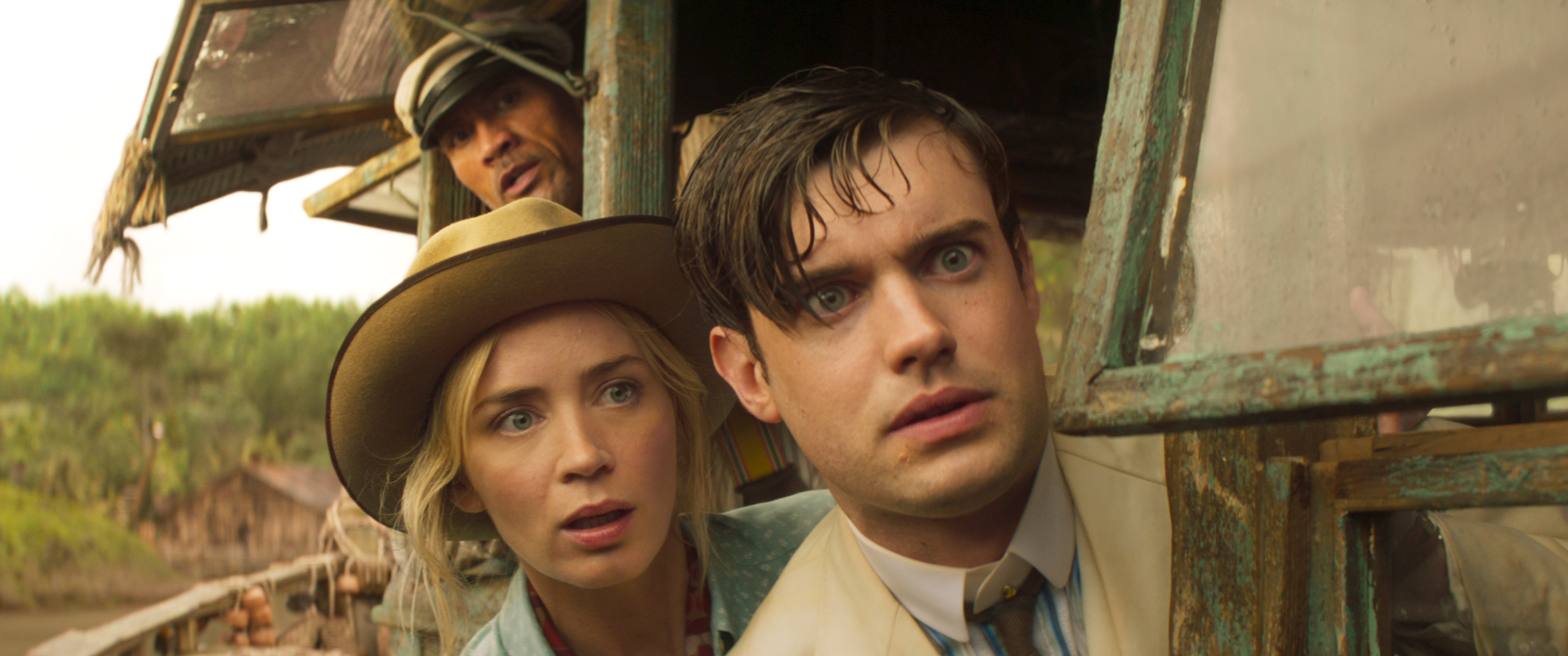 Dwayne Johnson, rear, Emily Blunt, and Jack Whitehall in "Jungle Cruise."
