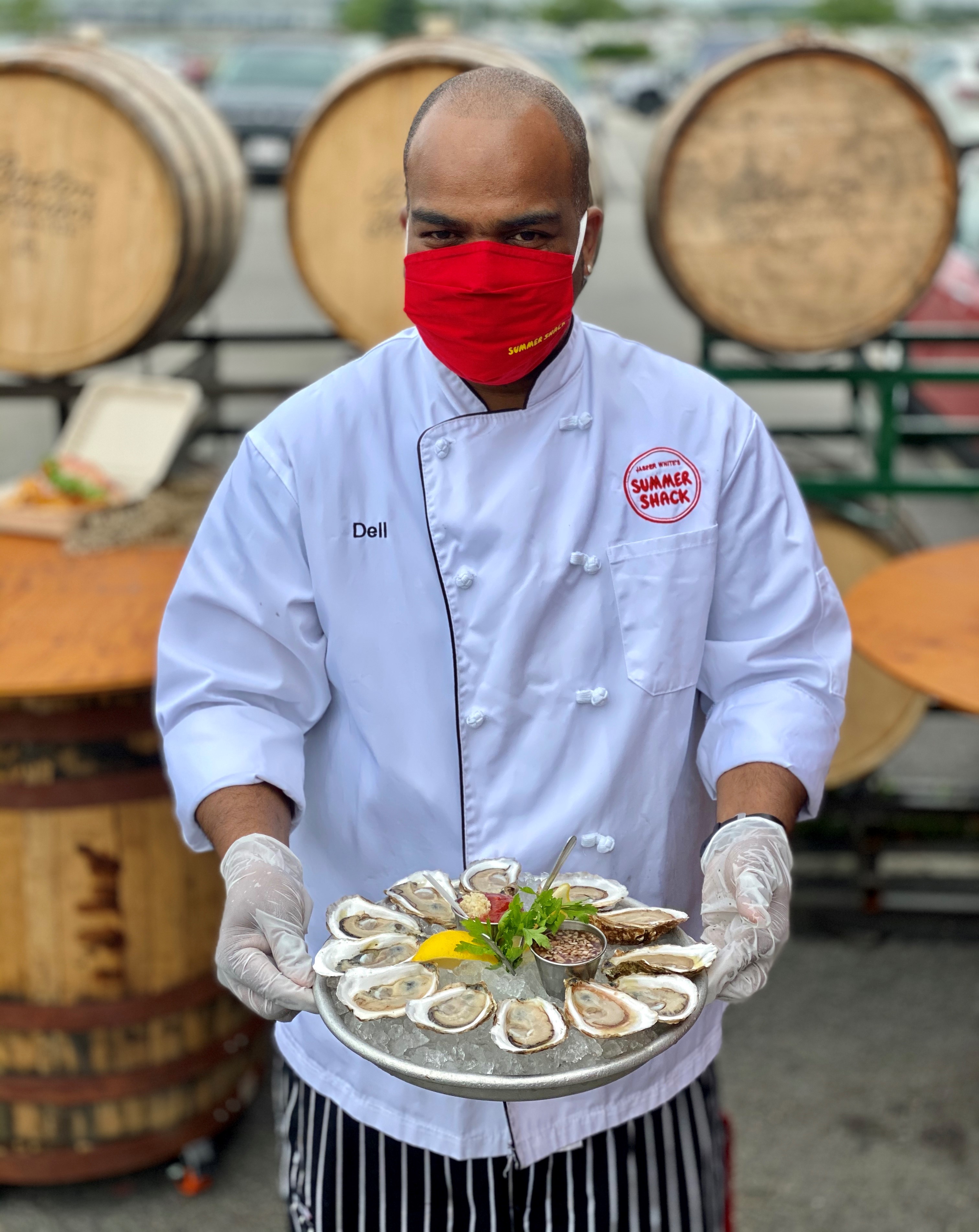 The Summer Shack's Dell Leandro offers up a plate of oysters.