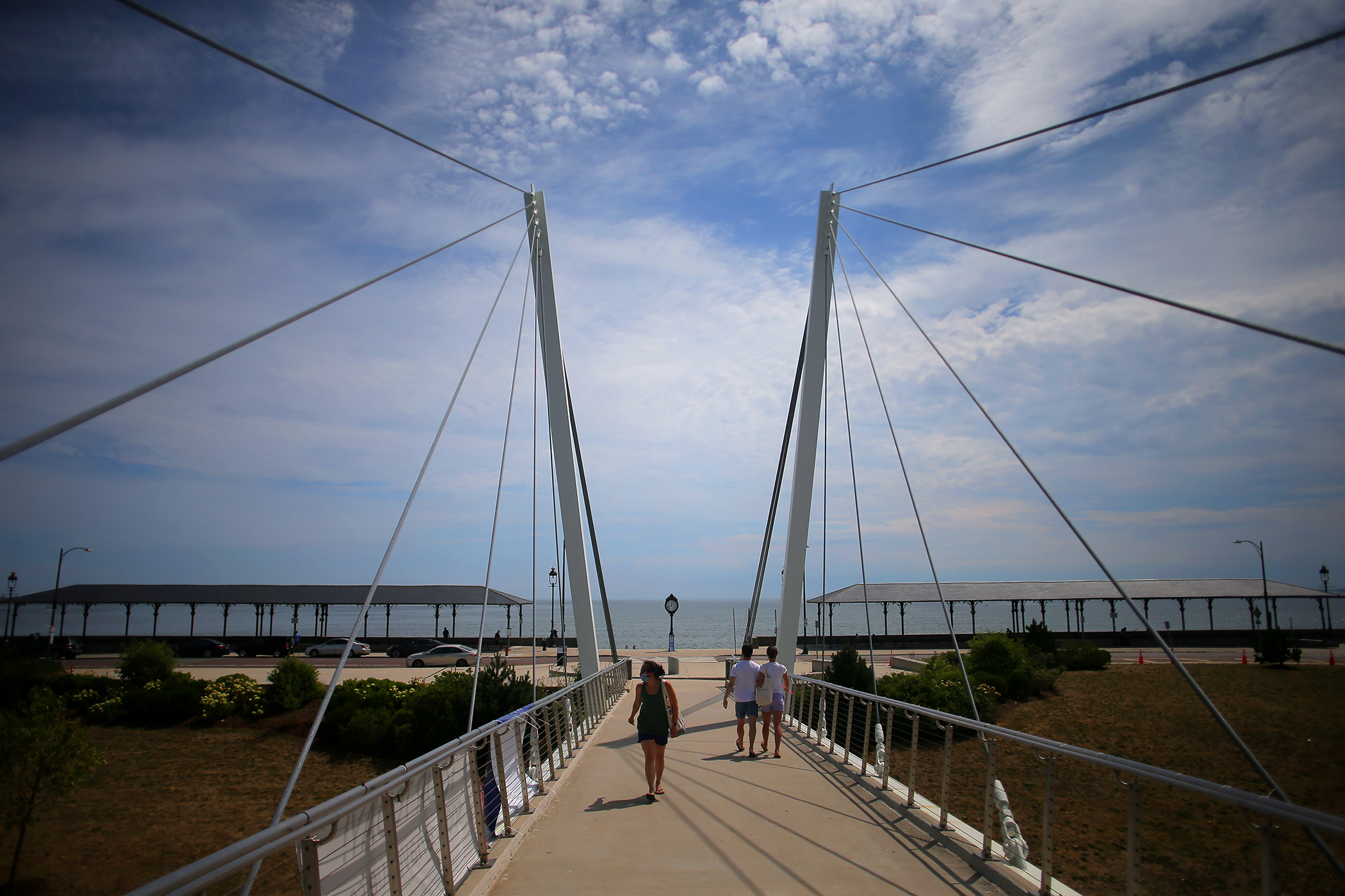Pedestrians crossed a footbridge connecting Ocean Avenue with the MBTA Blue Line plaza and Dryft restaurant.