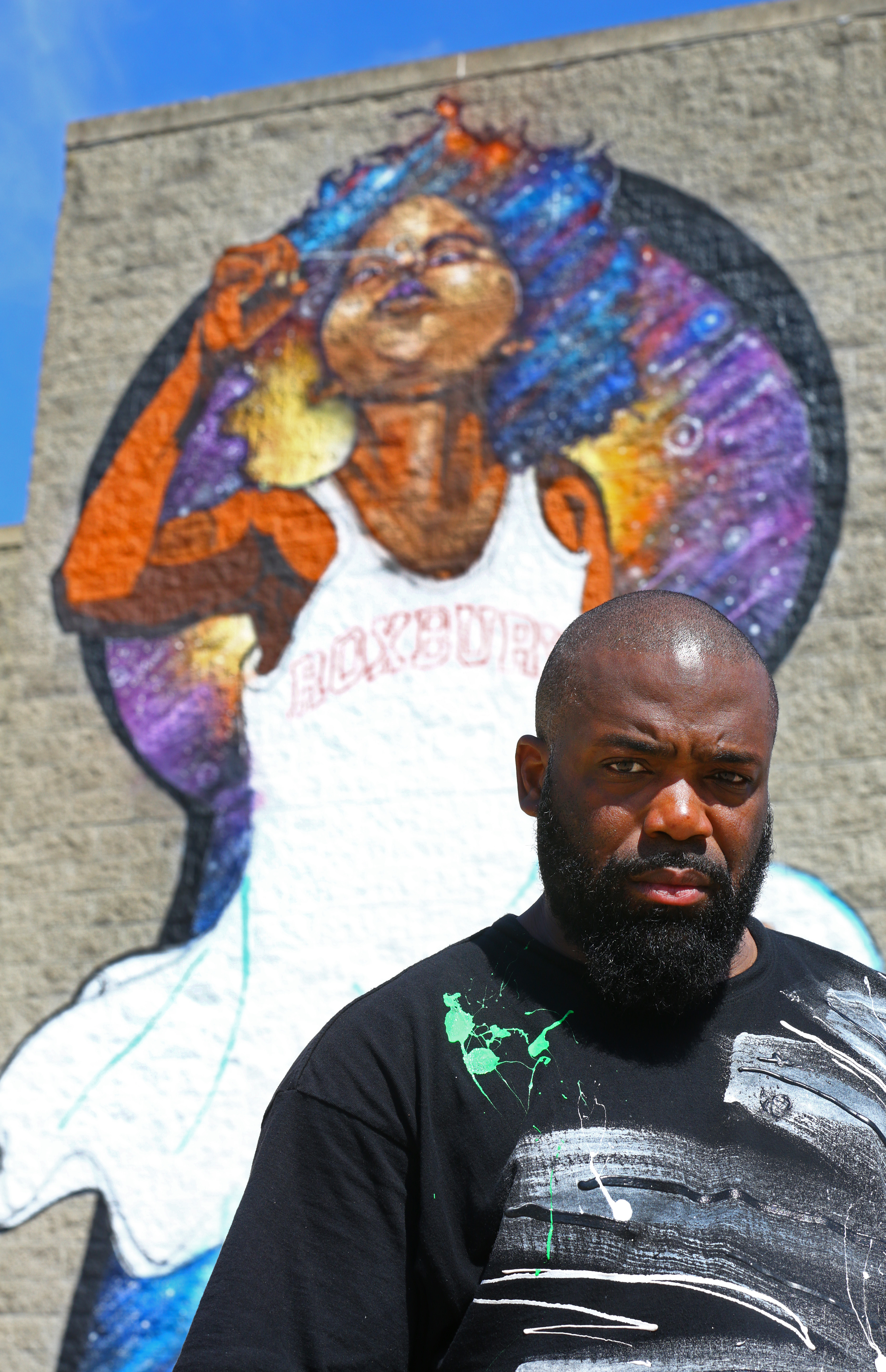 Rob "Problak" Gibbs stood with his MFA-commissioned work-in-progress, “Breathe Life 2.”