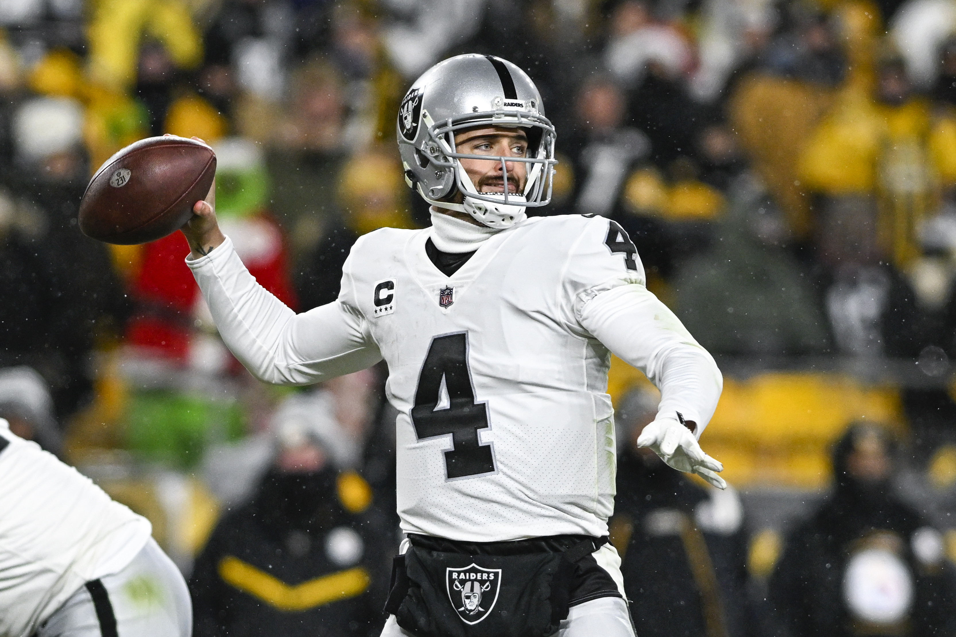 Las Vegas Raiders quarterback Chase Garbers (15) throws the ball on the  field before an NFL