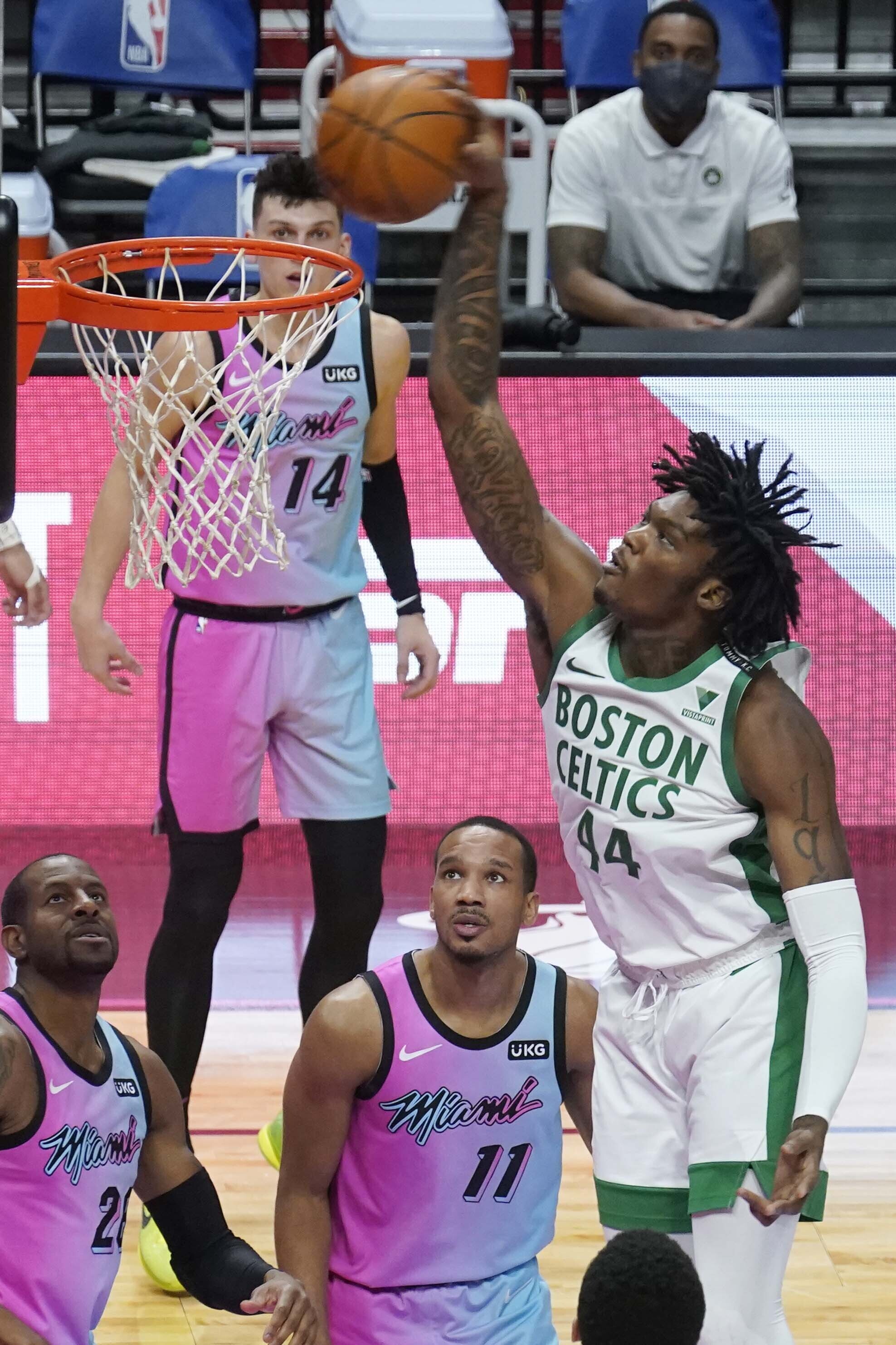 Robert Williams III dunks the ball over Miami's Avery Bradley and Andre Iguodala during the second half of Wednesday's game.