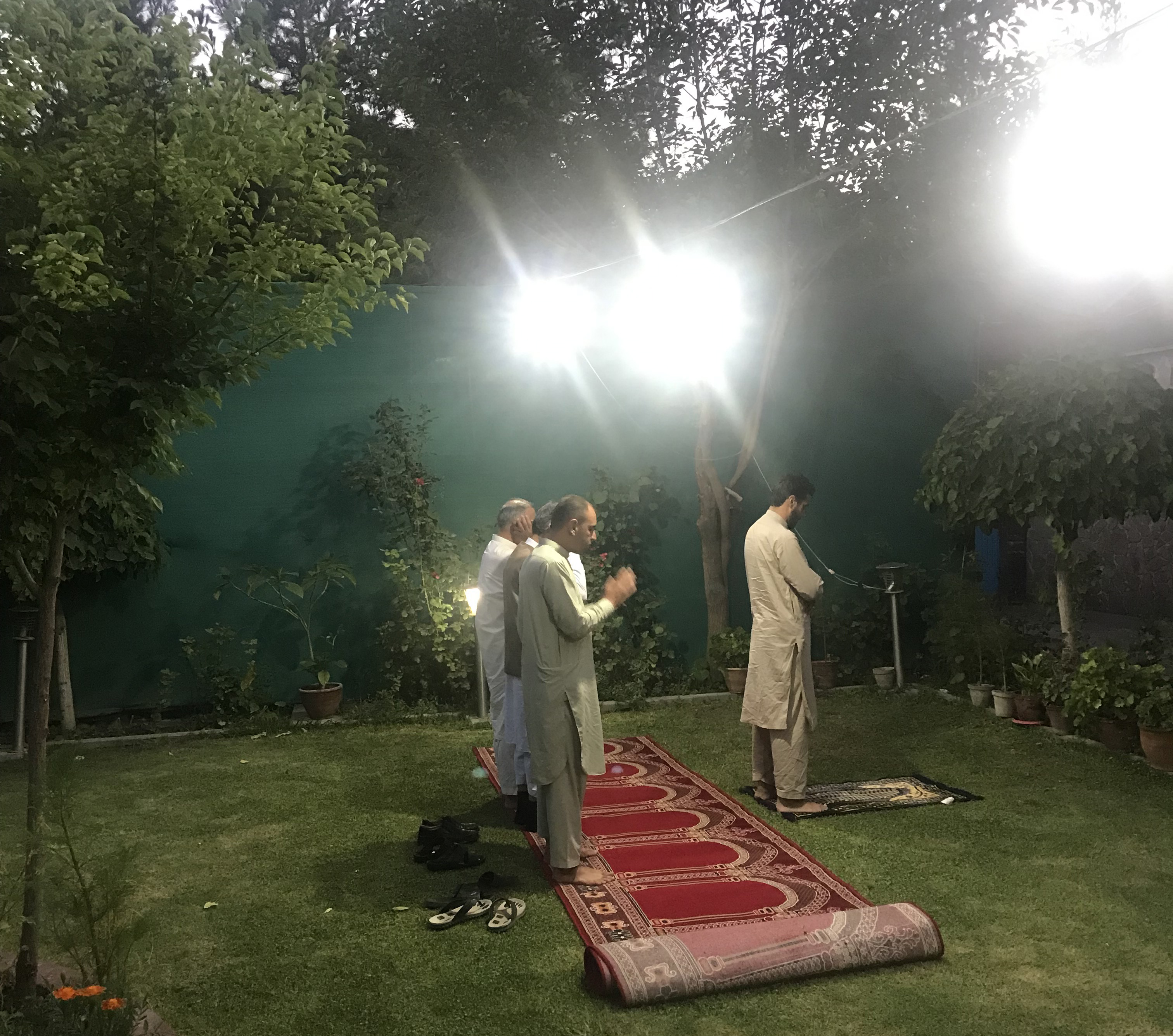 In the garden at WADAN, staff prayed.