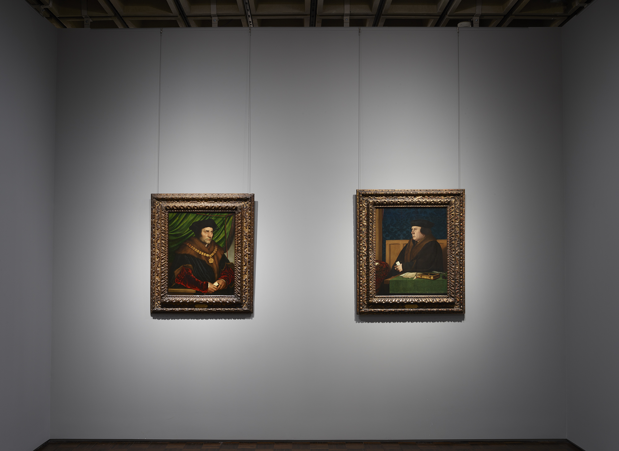 Portraits by Hans Holbein face off at Frick Madison. On the left is "Sir Thomas More," from 1527, with "Thomas Cromwell," from 1532, on the right.