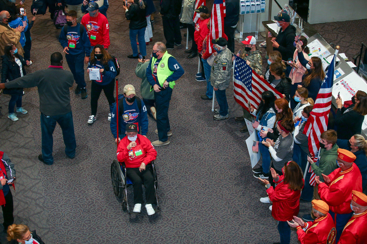 Supports cheer on veterans from WWII to Vietnam as they make their way through T. F. Green Aiport in Warwick, R.I., on they way to Washington D.C. about an Honor Flight, Saturday, Oct. 30, 2021.