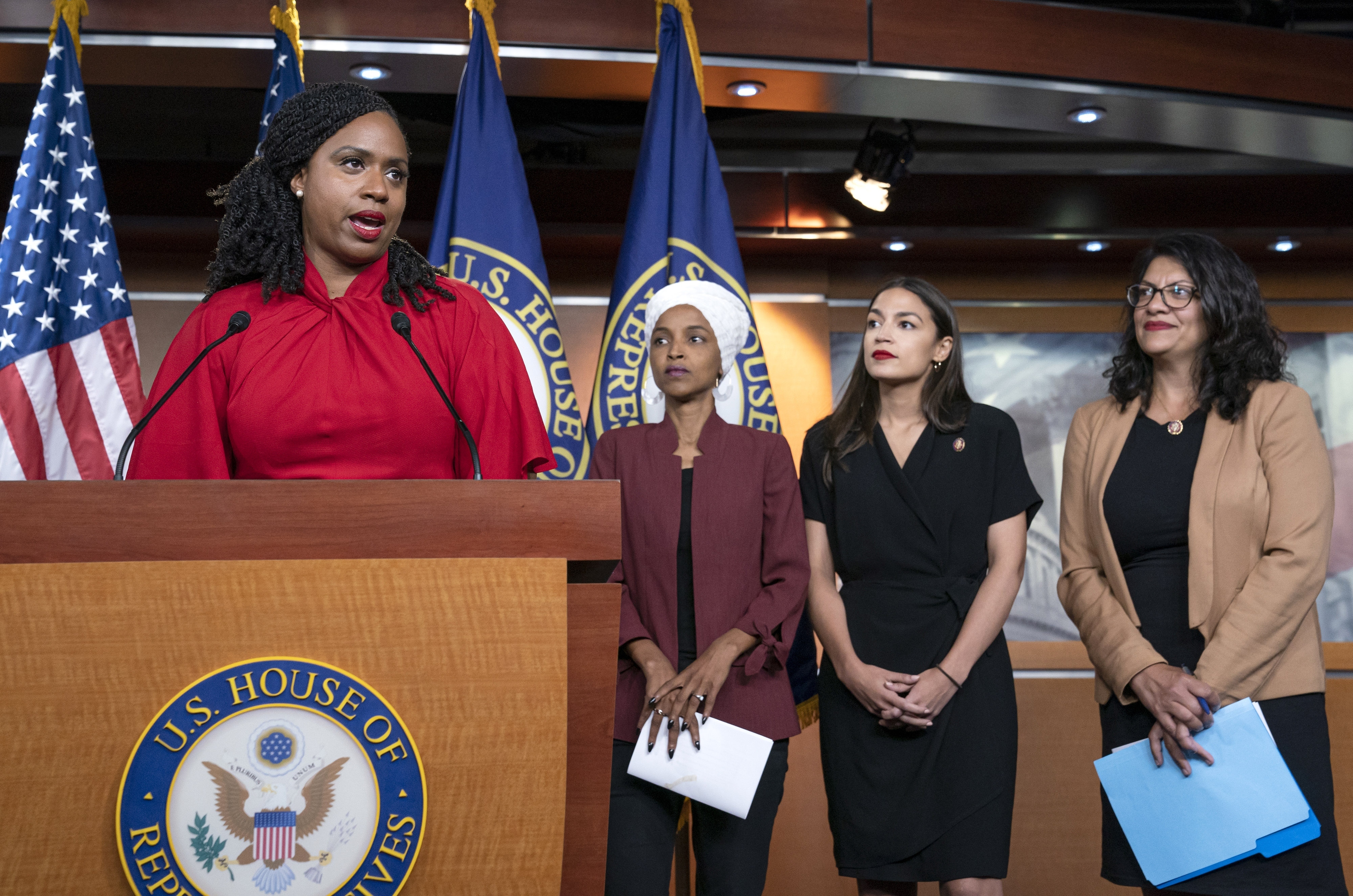 Representative Ayanna Pressley (left) and fellow Squad members Ilhan Omar, Alexandria Ocasio-Cortez, and Rashida Tlaib held a news conference in July 2019 to respond to President Trump after his call for the four Democrats to go back to their "broken" countries.